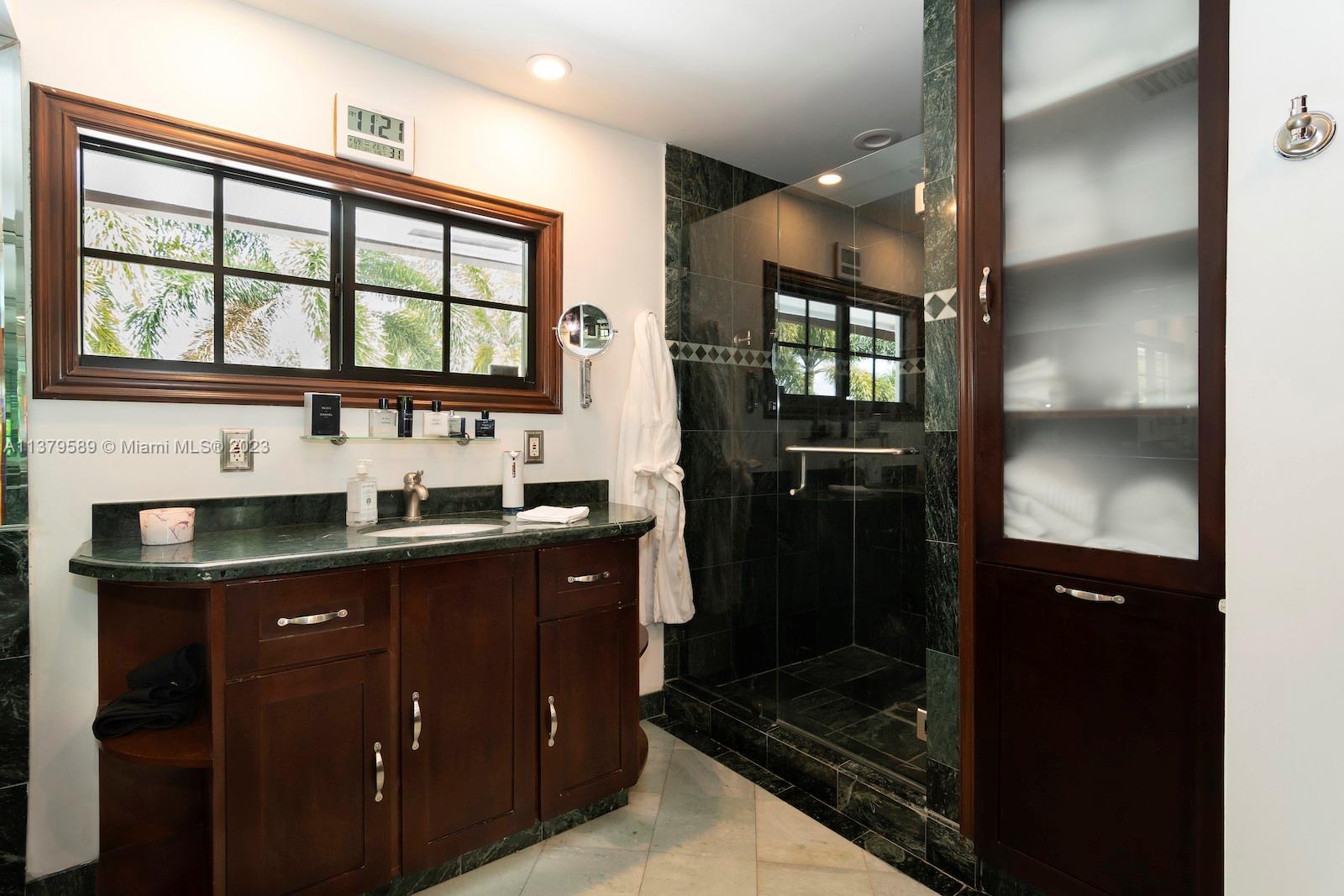 Doral Doral, FL 33178 - Photo 49 of 52 a kitchen with granite countertop a refrigerator and a sink