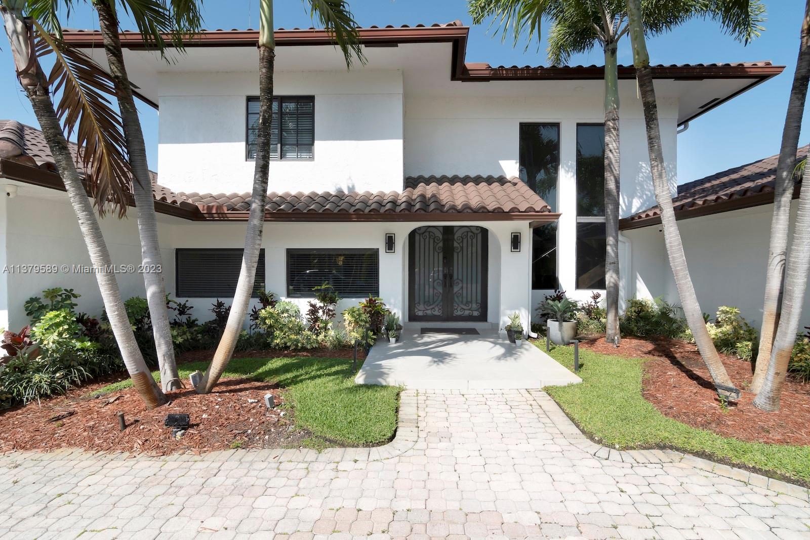 Doral Doral, FL 33178 - Photo 5 of 52 a front view of a house with garden