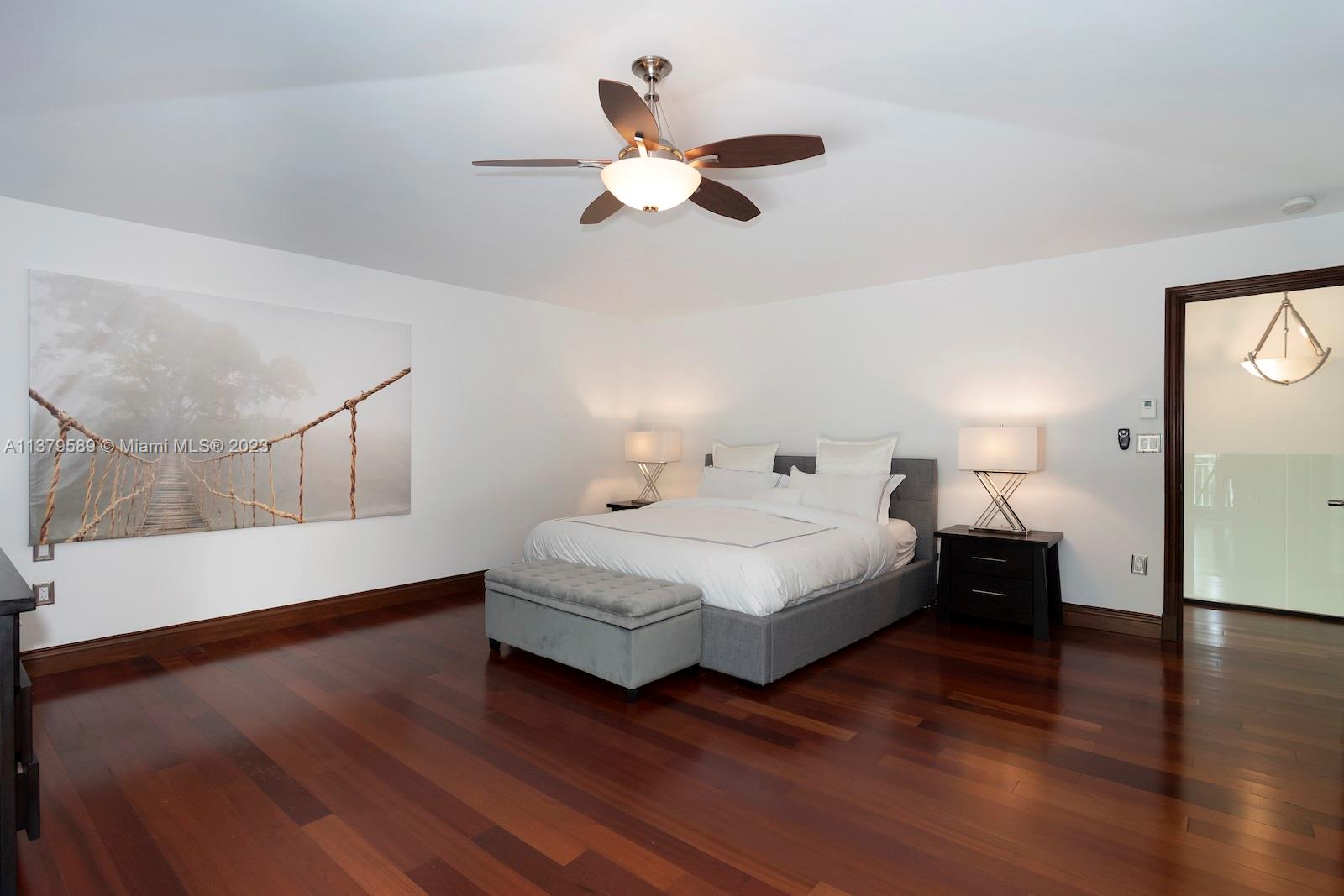 Doral Doral, FL 33178 - Photo 52 of 52 a spacious bedroom with a bed and a chandelier