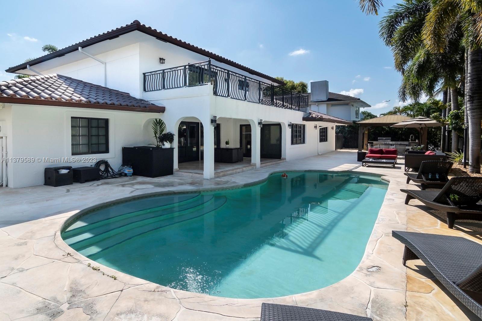 Doral Doral, FL 33178 - Photo 7 of 52 a view of a house with a couches balcony and a patio