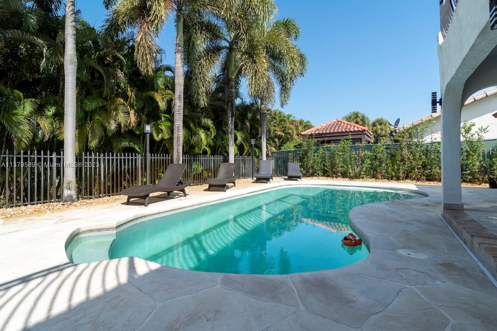 Doral Doral, FL 33178 - Photo 8 of 52 a view of a swimming pool with a patio