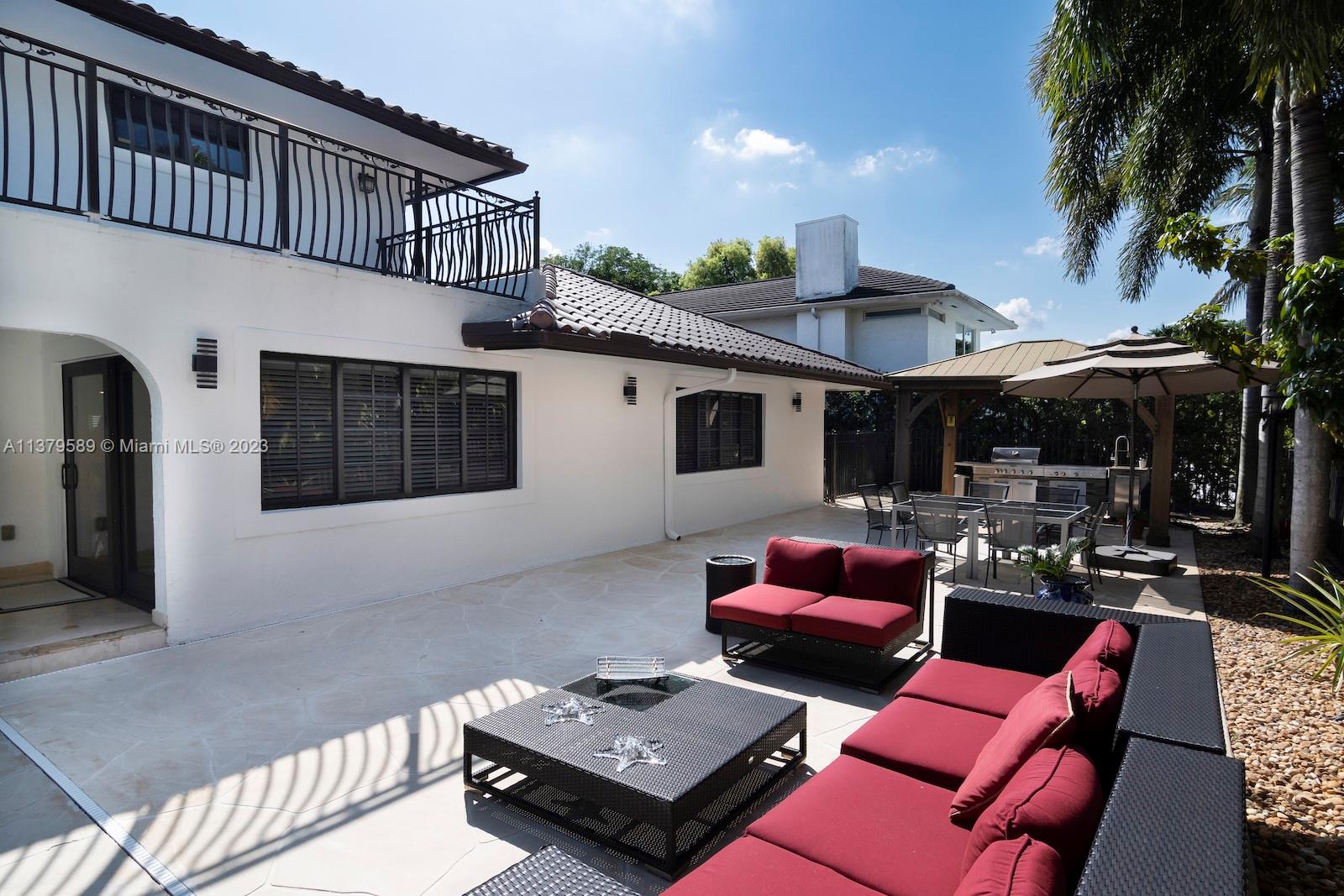 Doral Doral, FL 33178 - Photo 10 of 52 a outdoor living space with furniture and a potted plant