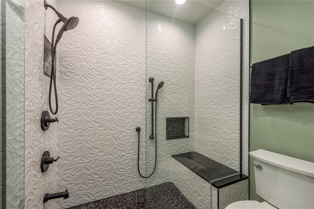 1381 McMullen Booth Road, Unit 1381 Clearwater, FL 33759 - Photo 18 of 36 a bathroom with a shower