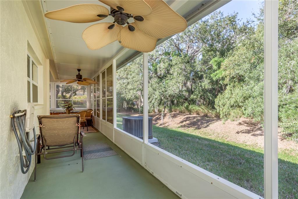 1381 McMullen Booth Road, Unit 1381 Clearwater, FL 33759 - Photo 26 of 36 a view of a porch with furniture and a yard