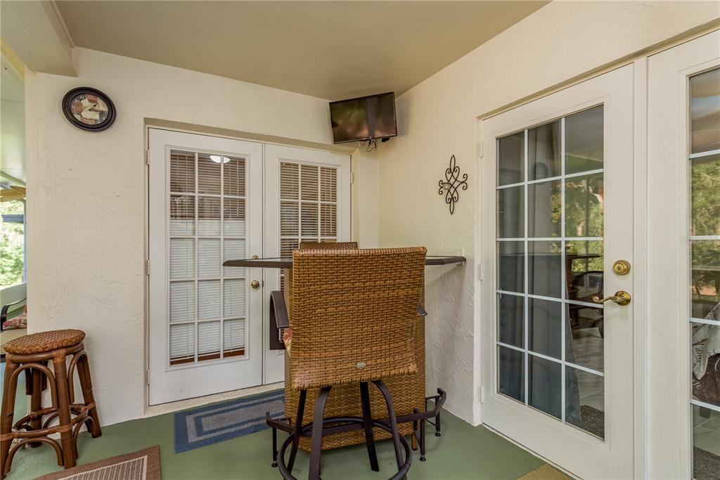 1381 McMullen Booth Road, Unit 1381 Clearwater, FL 33759 - Photo 27 of 36 a view of workspace with wooden floor and windows