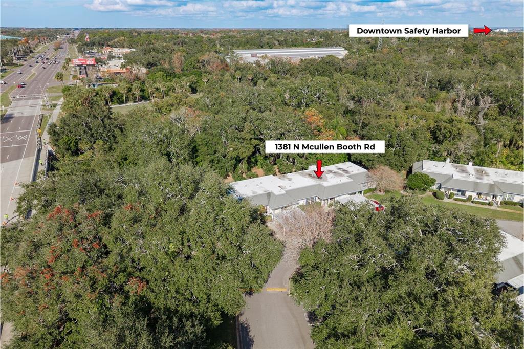 1381 McMullen Booth Road, Unit 1381 Clearwater, FL 33759 - Photo 30 of 36 an aerial view of a house with a yard