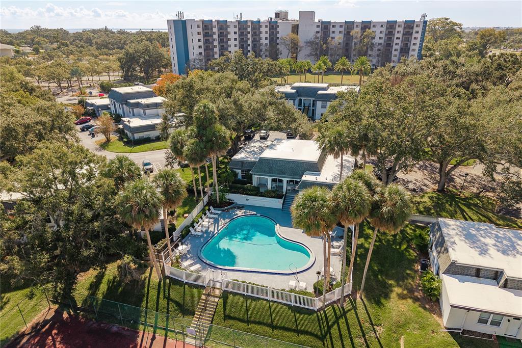 1381 McMullen Booth Road, Unit 1381 Clearwater, FL 33759 - Photo 32 of 36 a balcony with table and chairs