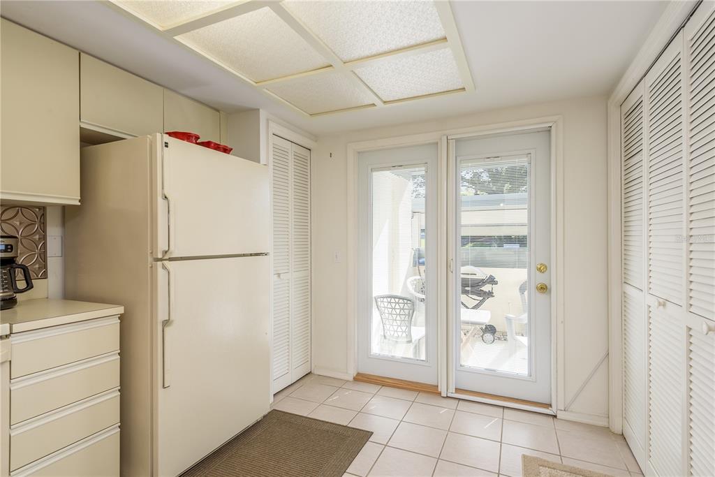 1381 McMullen Booth Road, Unit 1381 Clearwater, FL 33759 - Photo 8 of 36 a view of a kitchen with refrigerator and cabinet