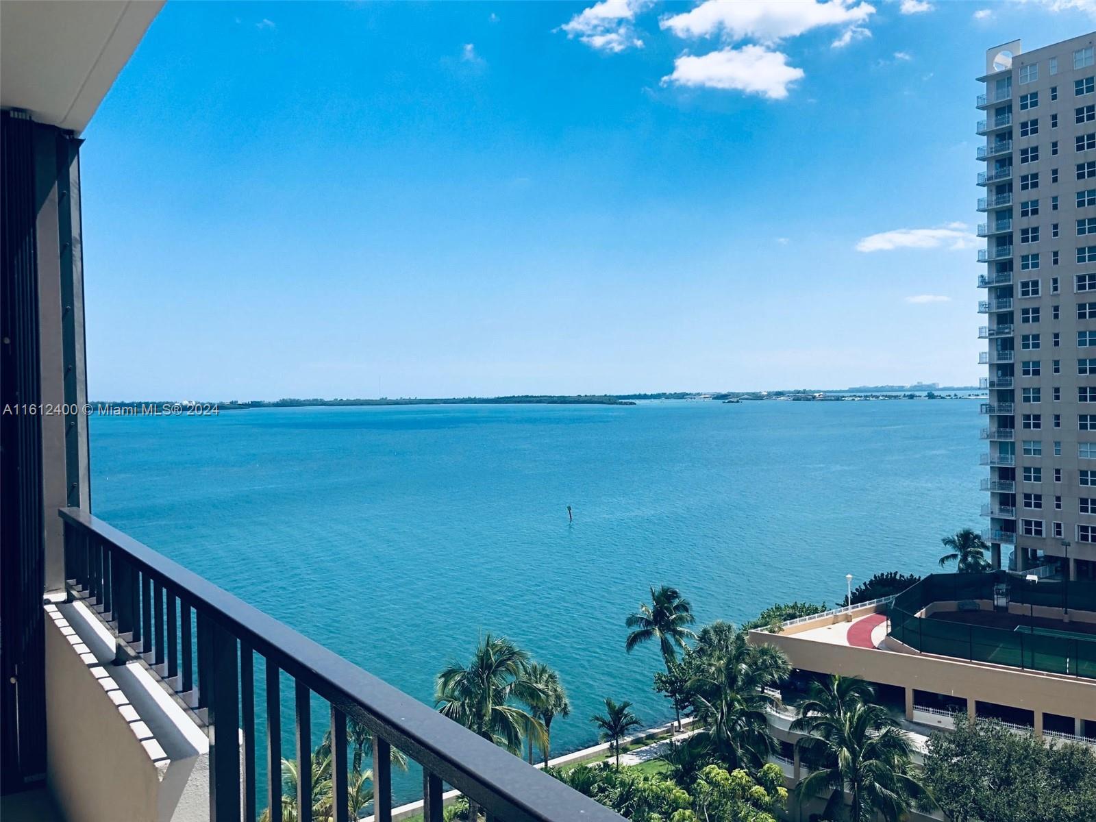 520 Brickell Key Drive, Unit A1005 Miami, FL 33131 - Photo 1 of 20 a view of a balcony with an ocean view