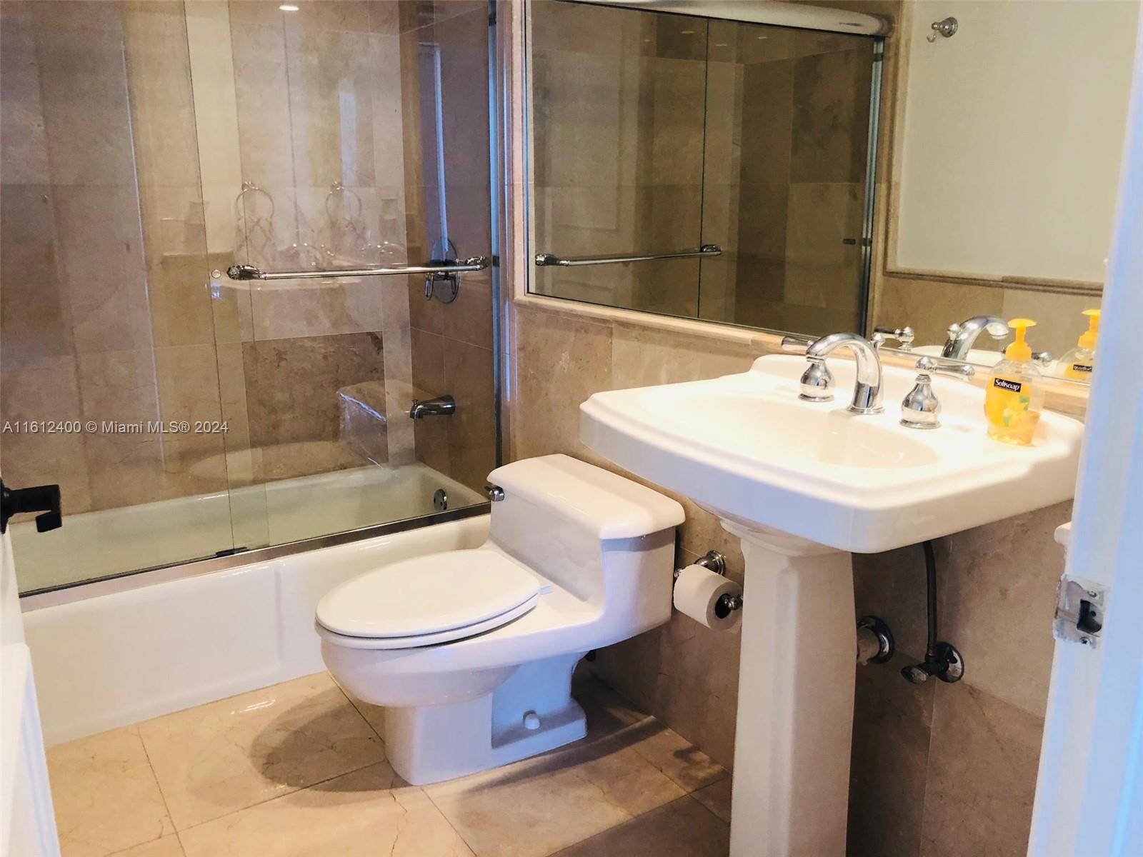 520 Brickell Key Drive, Unit A1005 Miami, FL 33131 - Photo 15 of 20 a bathroom with a sink toilet and shower