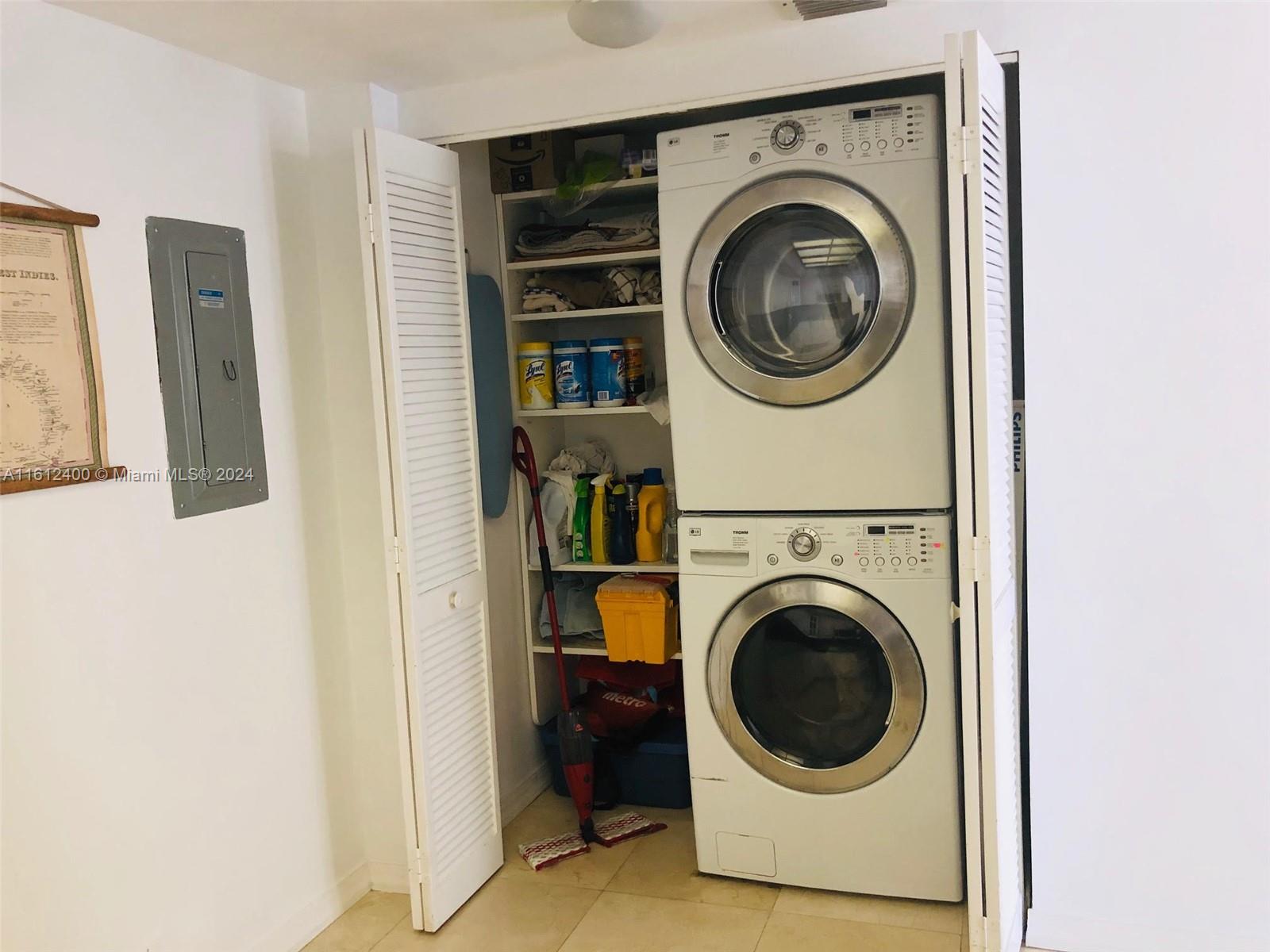 520 Brickell Key Drive, Unit A1005 Miami, FL 33131 - Photo 16 of 20 a utility room with dryer and washer