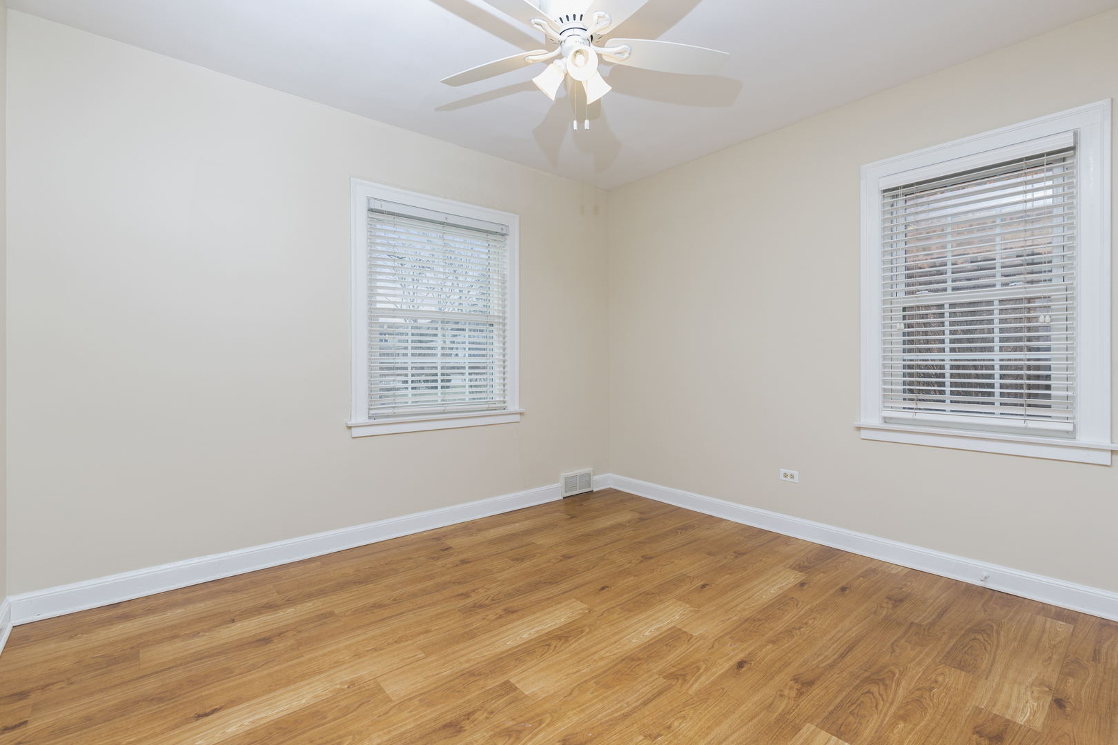 27 North Delaplaine Road Riverside, IL 60546 - Photo 15 of 32 a view of an empty room with wooden floor and a window