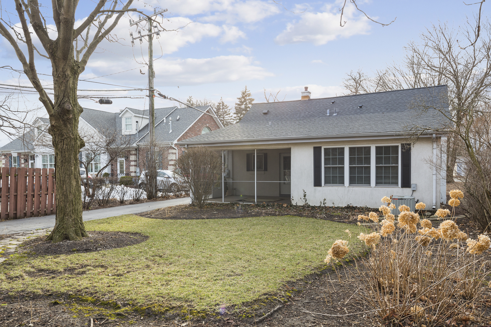 27 North Delaplaine Road Riverside, IL 60546 - Photo 24 of 32 a front view of a house with a yard and potted plants