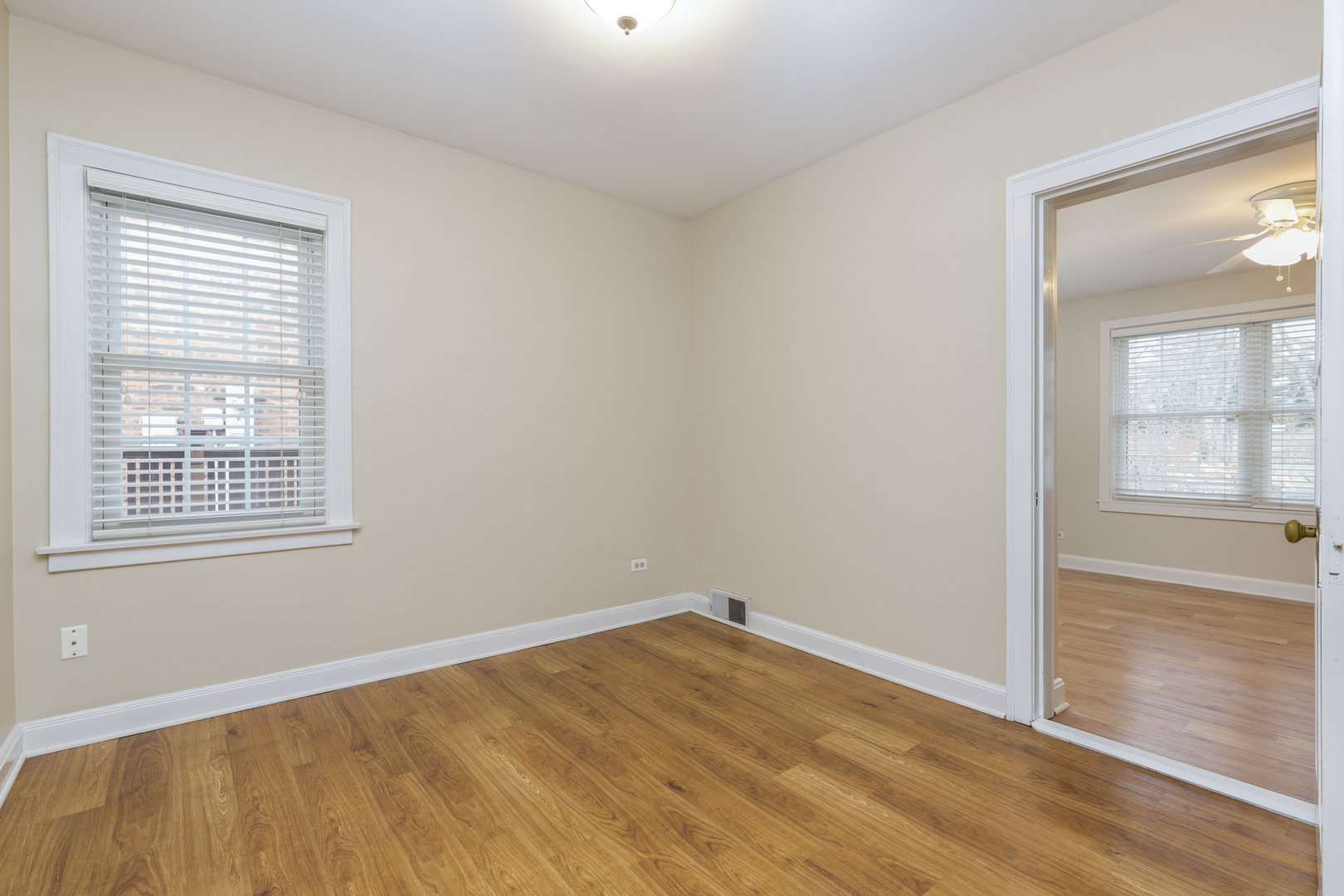 27 North Delaplaine Road Riverside, IL 60546 - Photo 9 of 32 a view of empty room with wooden floor and fan