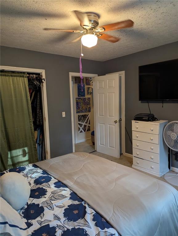 778 Poseyville Road Bremen, GA 30110 - Photo 19 of 27 a bedroom with a bed and a flat screen tv