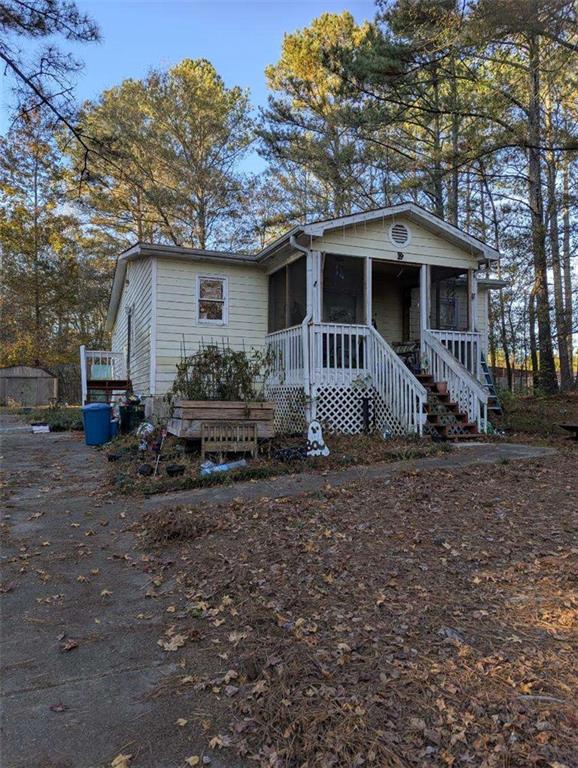 778 Poseyville Road Bremen, GA 30110 - Photo 2 of 27 a front view of a house with garden