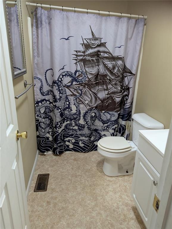 778 Poseyville Road Bremen, GA 30110 - Photo 23 of 27 a bathroom with a toilet and a shower