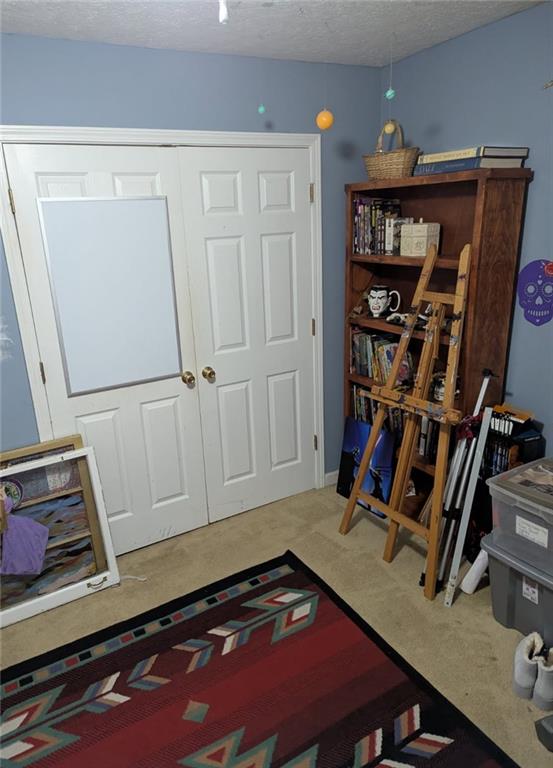 778 Poseyville Road Bremen, GA 30110 - Photo 25 of 27 a room with furniture and book shelf