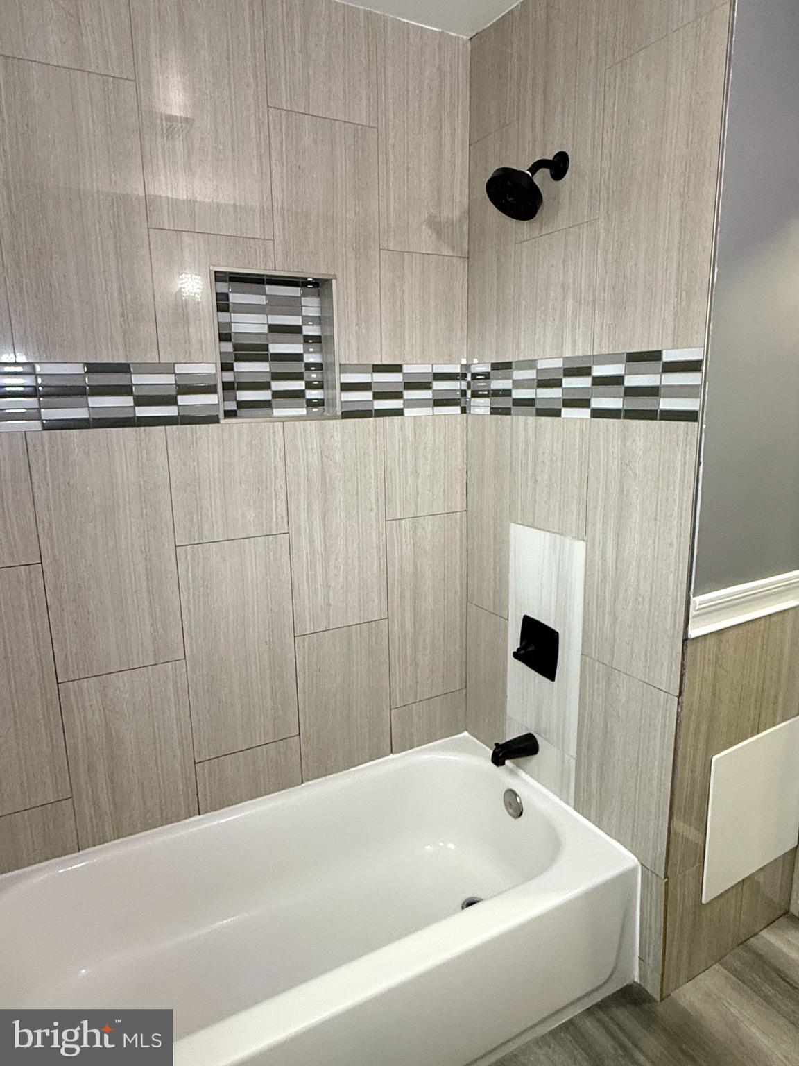 1803 Amherst Road Hyattsville, MD 20783 - Photo 13 of 17 a bathroom with a bathtub and a shower