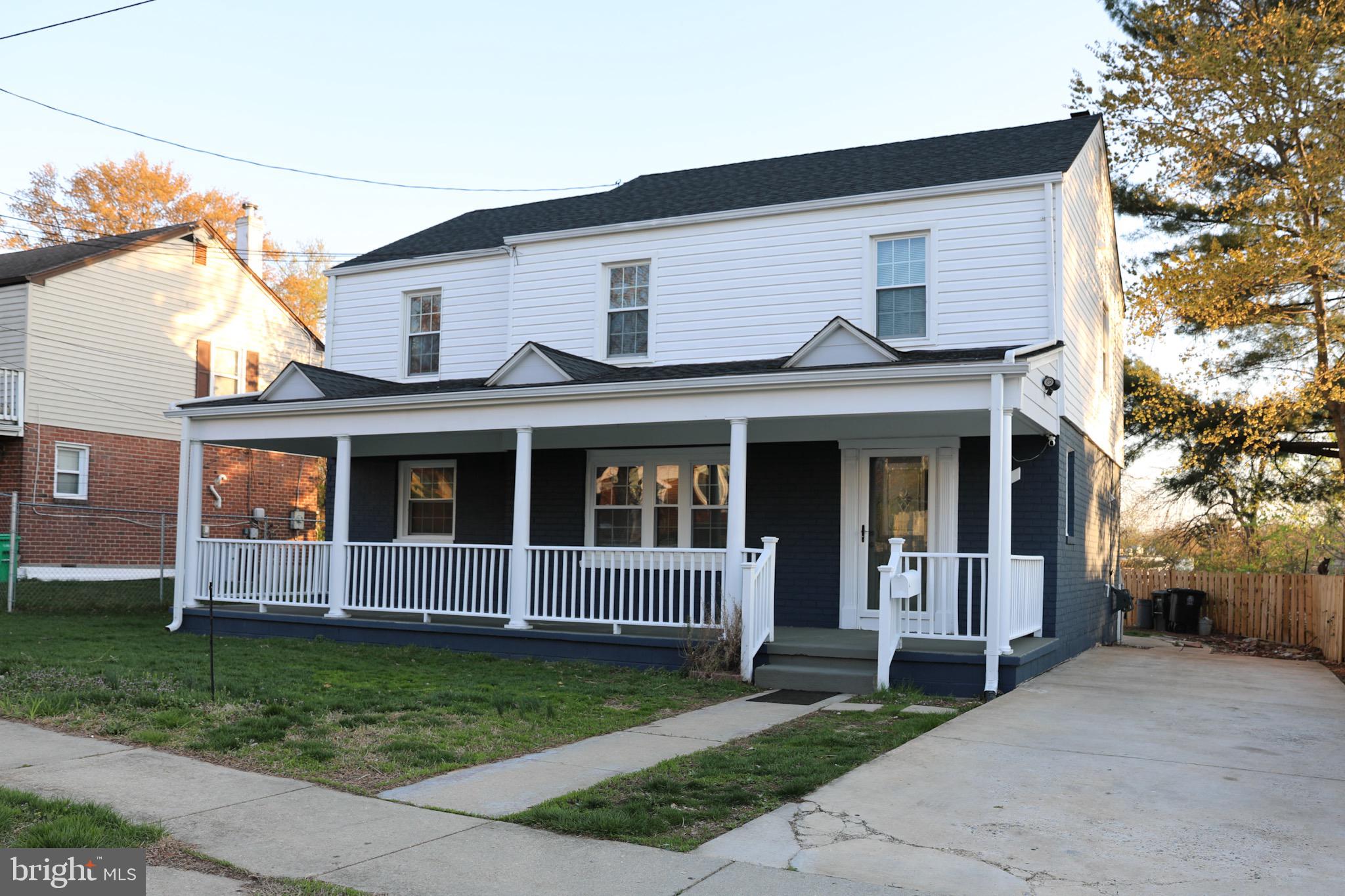 1803 Amherst Road Hyattsville, MD 20783 - Photo 2 of 17 a view of a white house with a small yard and large trees