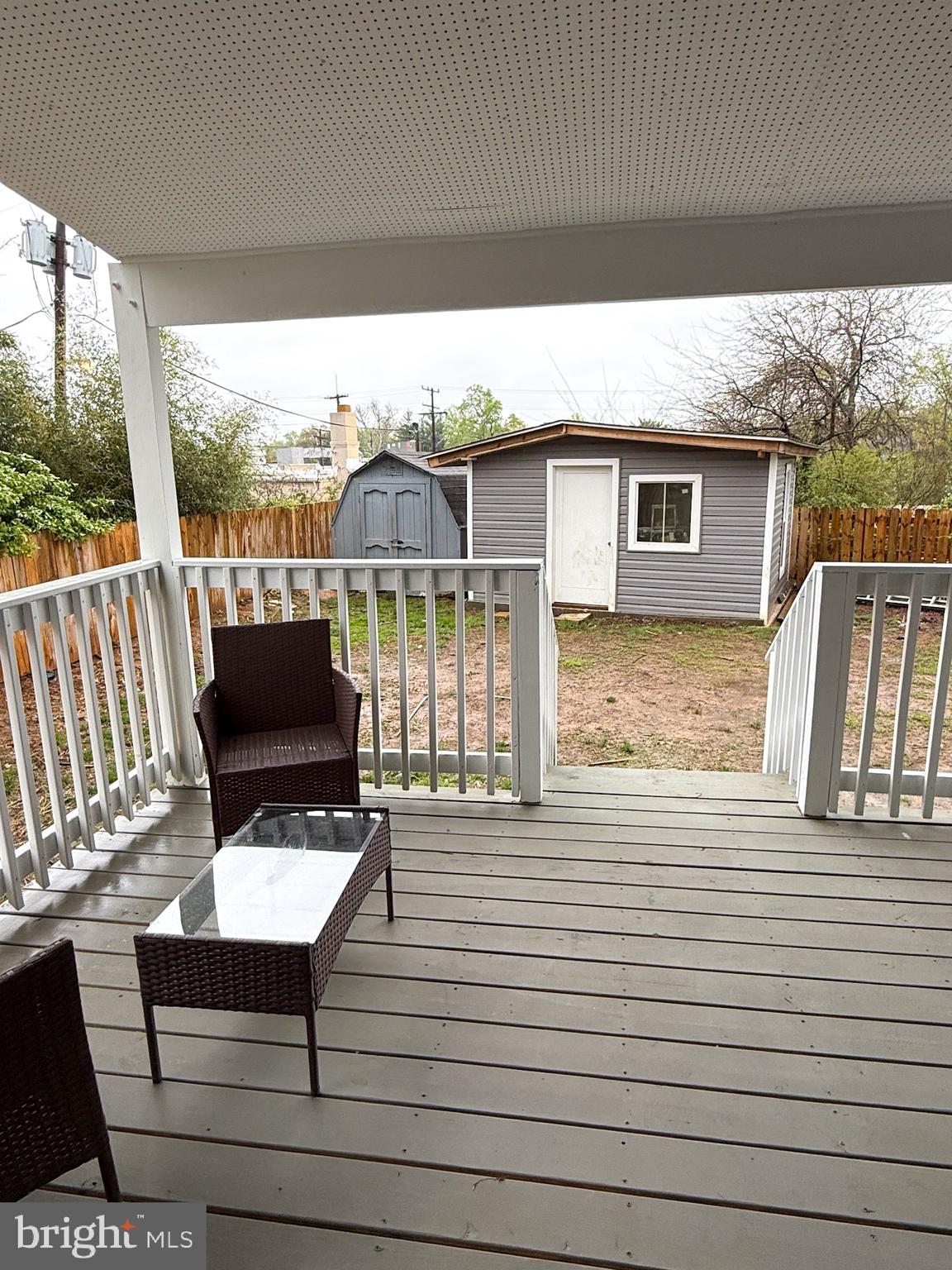 1803 Amherst Road Hyattsville, MD 20783 - Photo 9 of 17 a view of a roof deck with wooden floor and fence