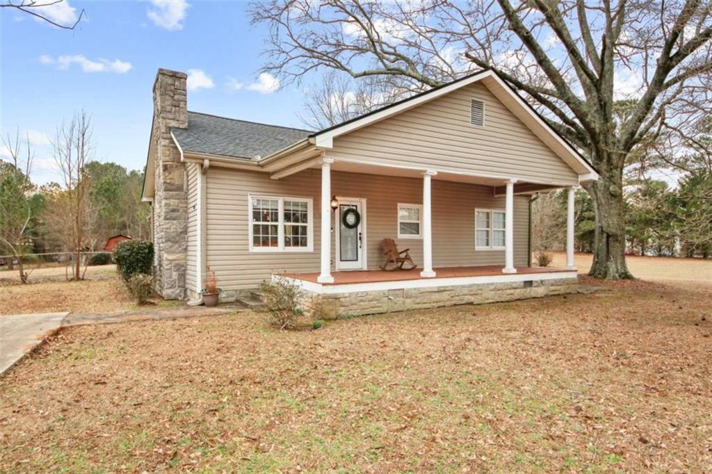 3685 Tackett Road Douglasville, GA 30135 - Photo 1 of 1 a view of a house with a yard and tree