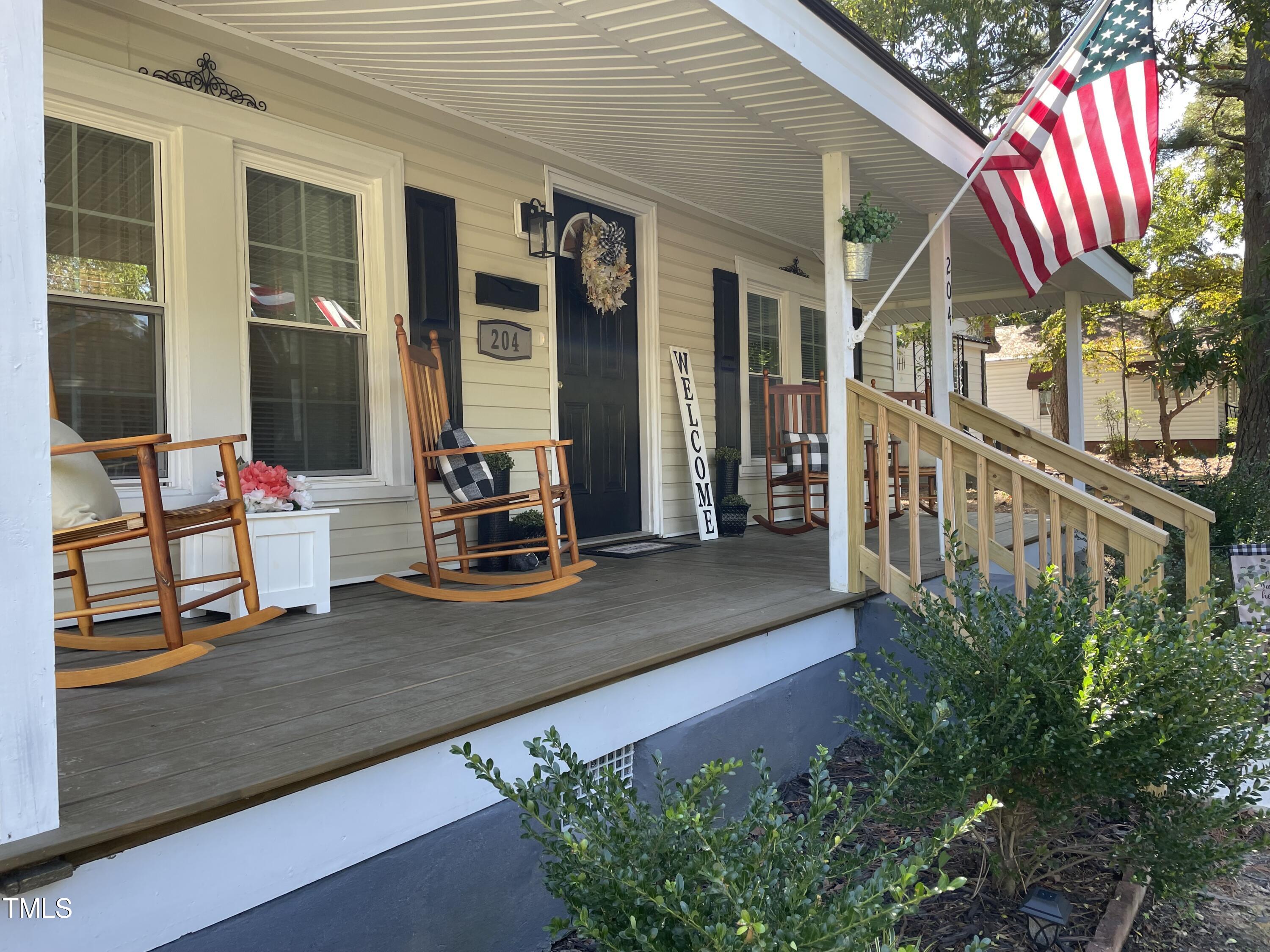 204 Jackson Street Dunn, NC 28334 - Photo 11 of 49 a front view of a house with outdoor seating