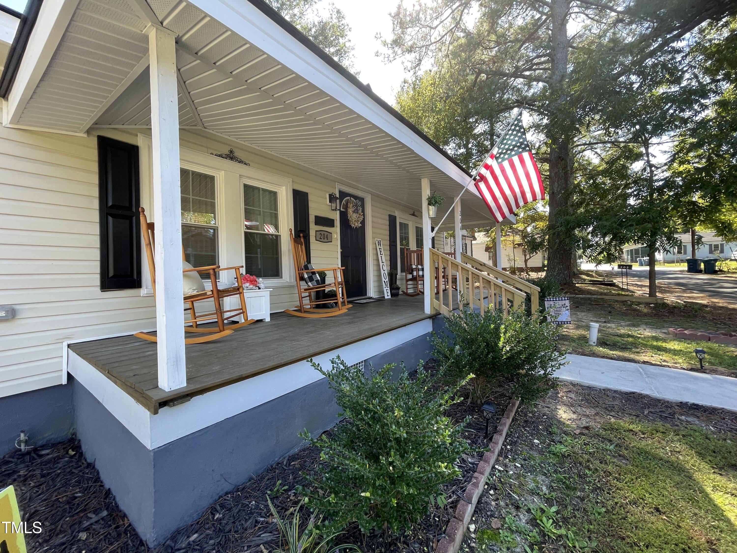 204 Jackson Street Dunn, NC 28334 - Photo 12 of 49 a front view of a house with garden