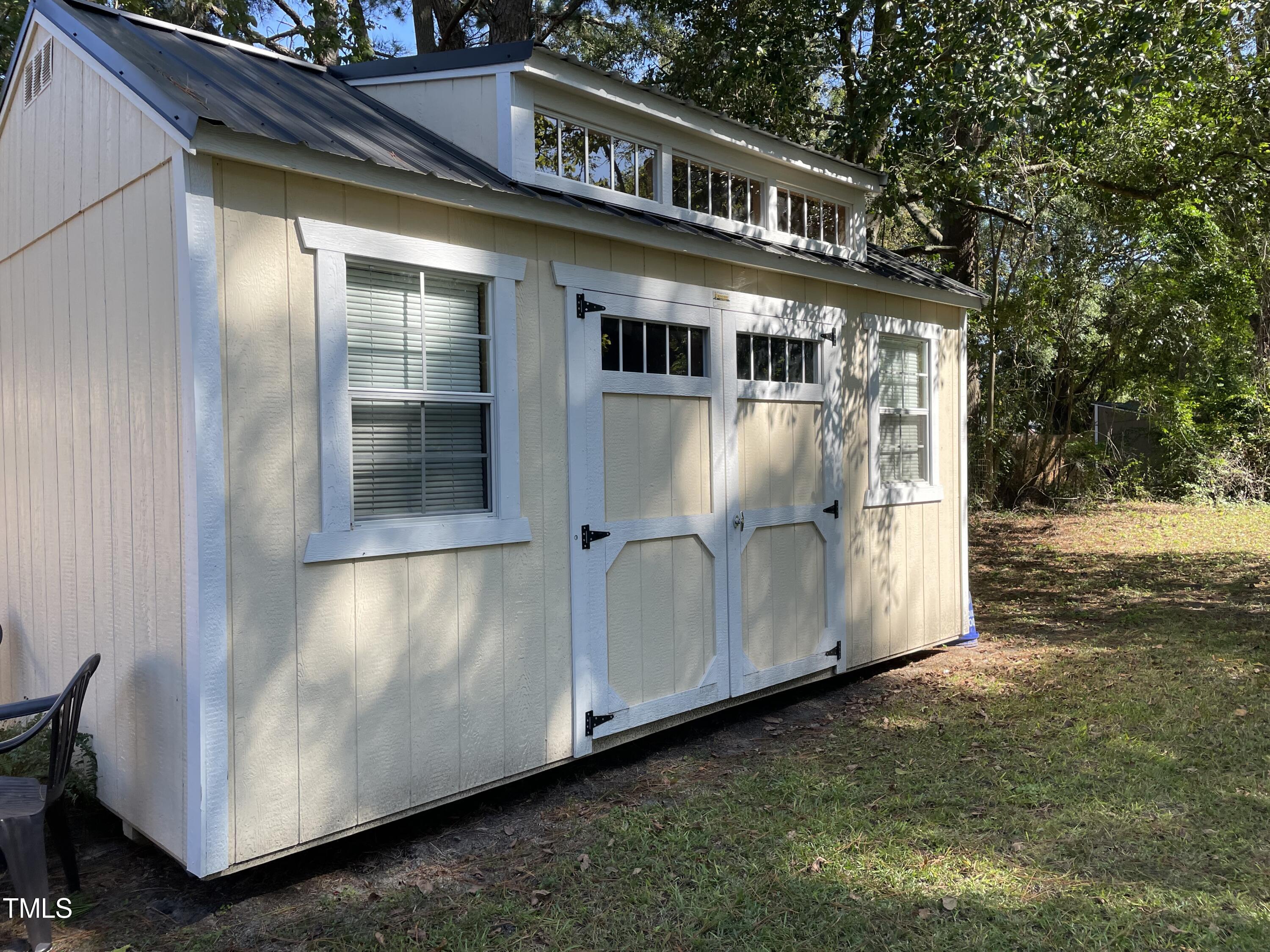 204 Jackson Street Dunn, NC 28334 - Photo 15 of 49 a view of a house with backyard