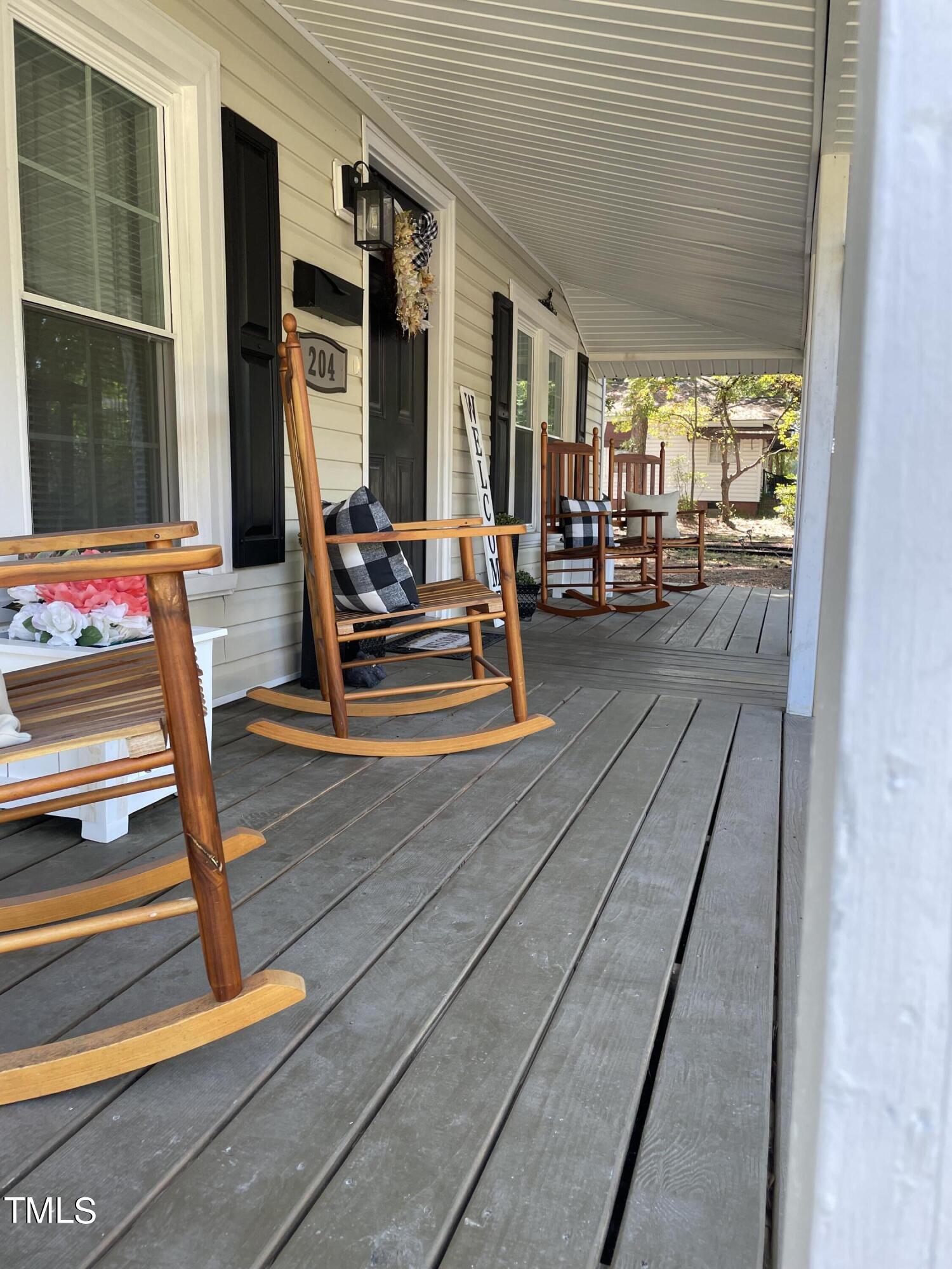 204 Jackson Street Dunn, NC 28334 - Photo 21 of 49 a view of backyard with a large window and wooden floor