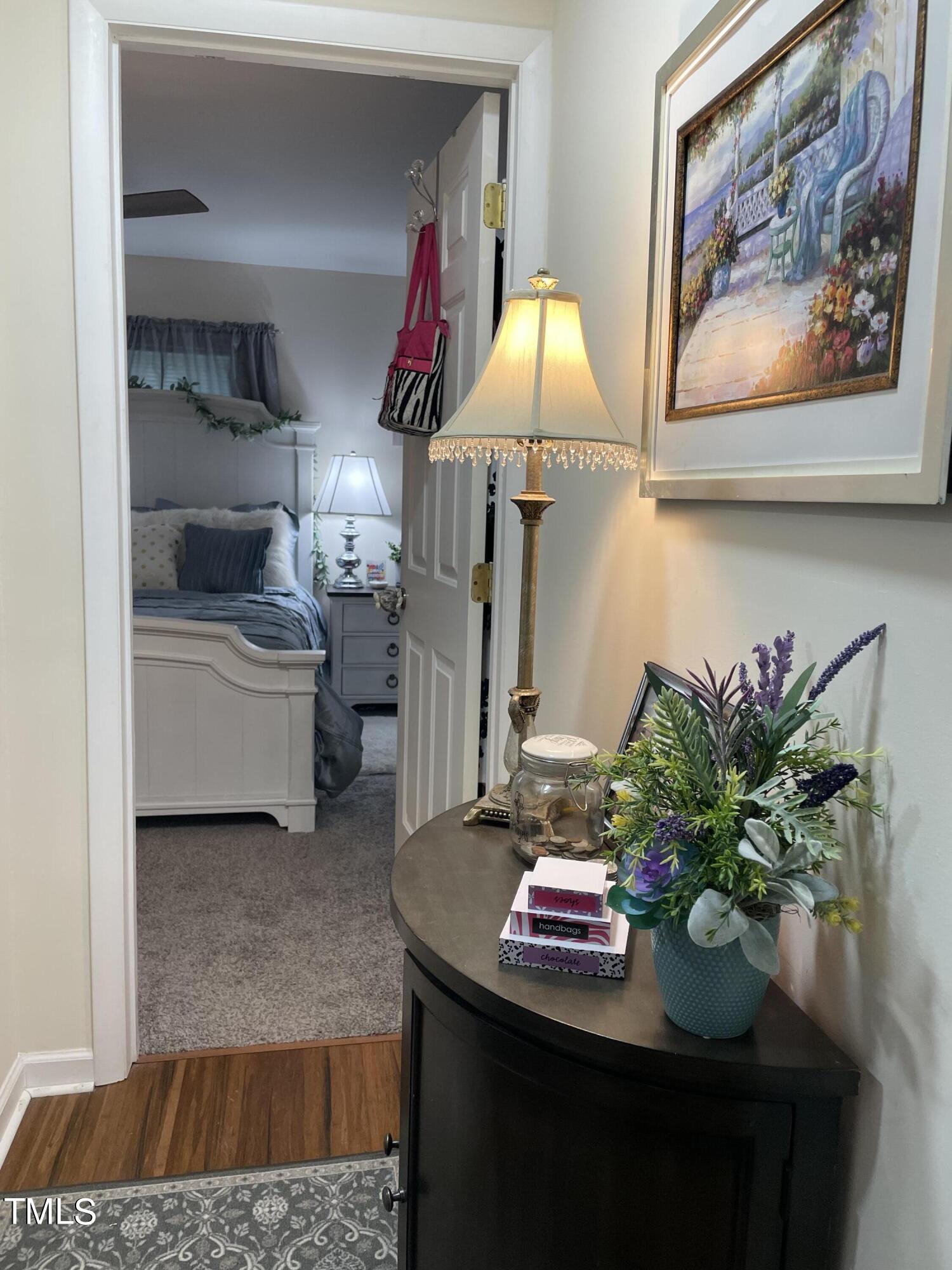 204 Jackson Street Dunn, NC 28334 - Photo 23 of 49 a living room with furniture and flowers