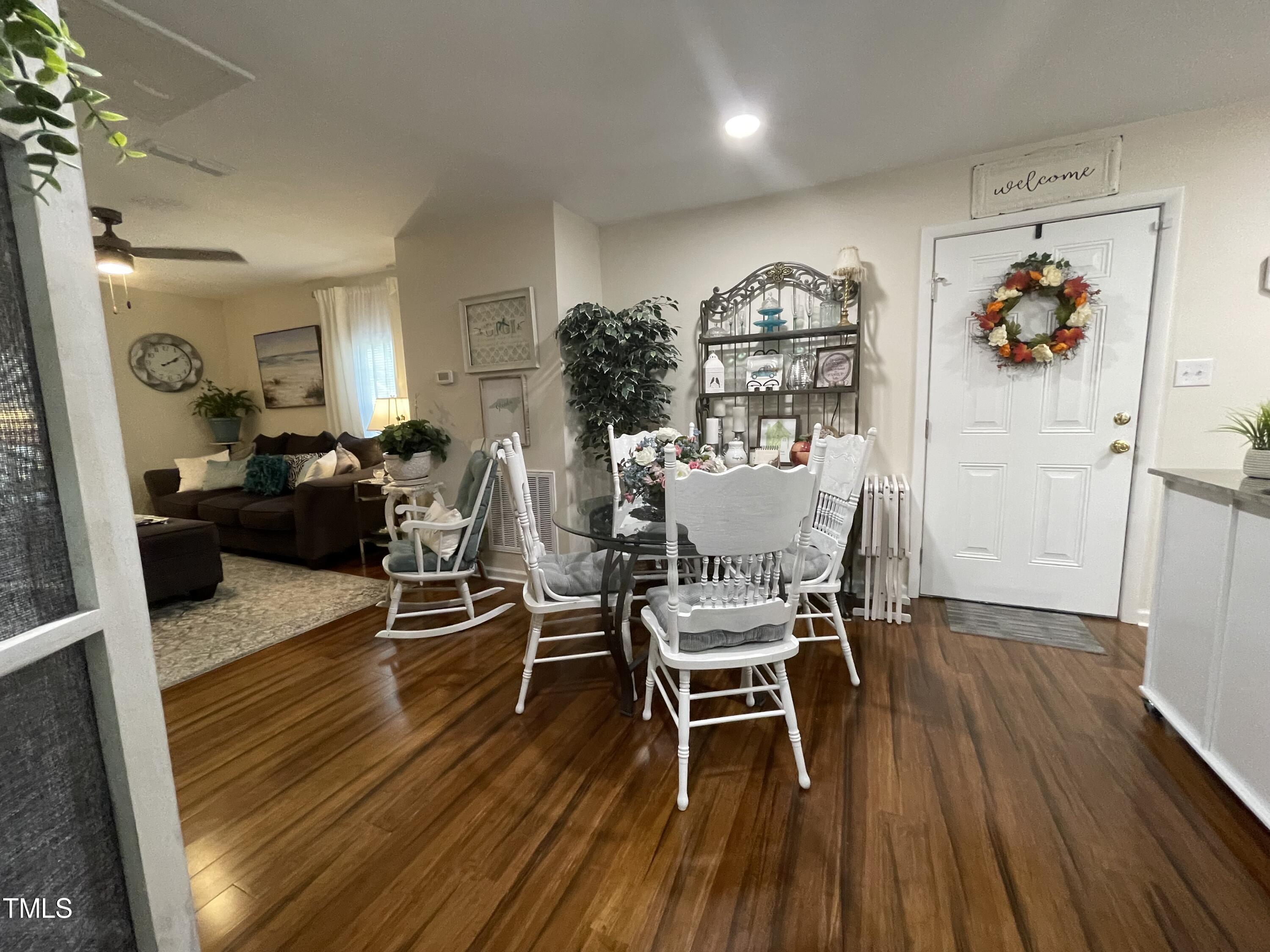 204 Jackson Street Dunn, NC 28334 - Photo 32 of 49 a living room with furniture and wooden floor