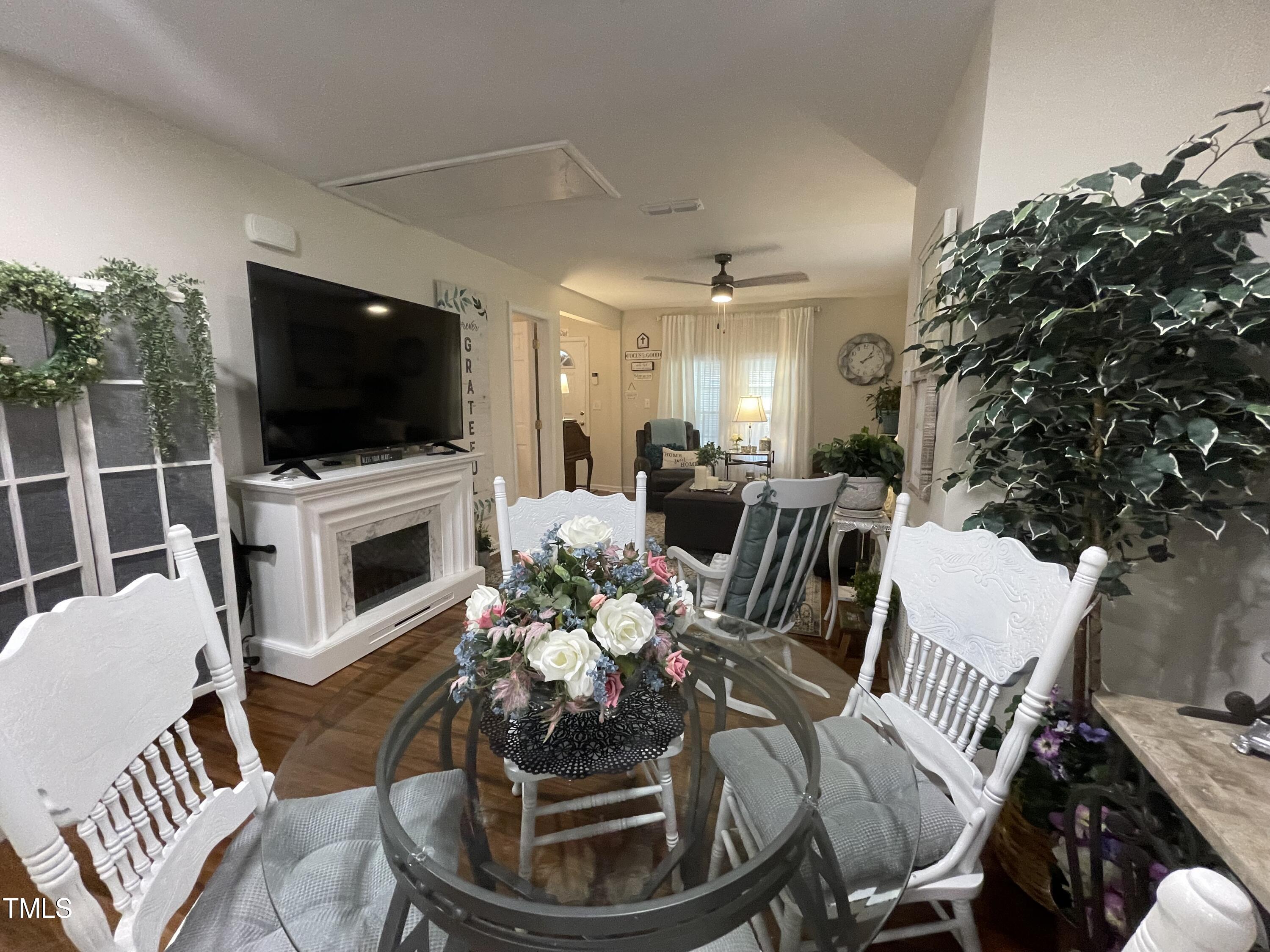 204 Jackson Street Dunn, NC 28334 - Photo 34 of 49 a living room with furniture a flat screen tv and a fireplace