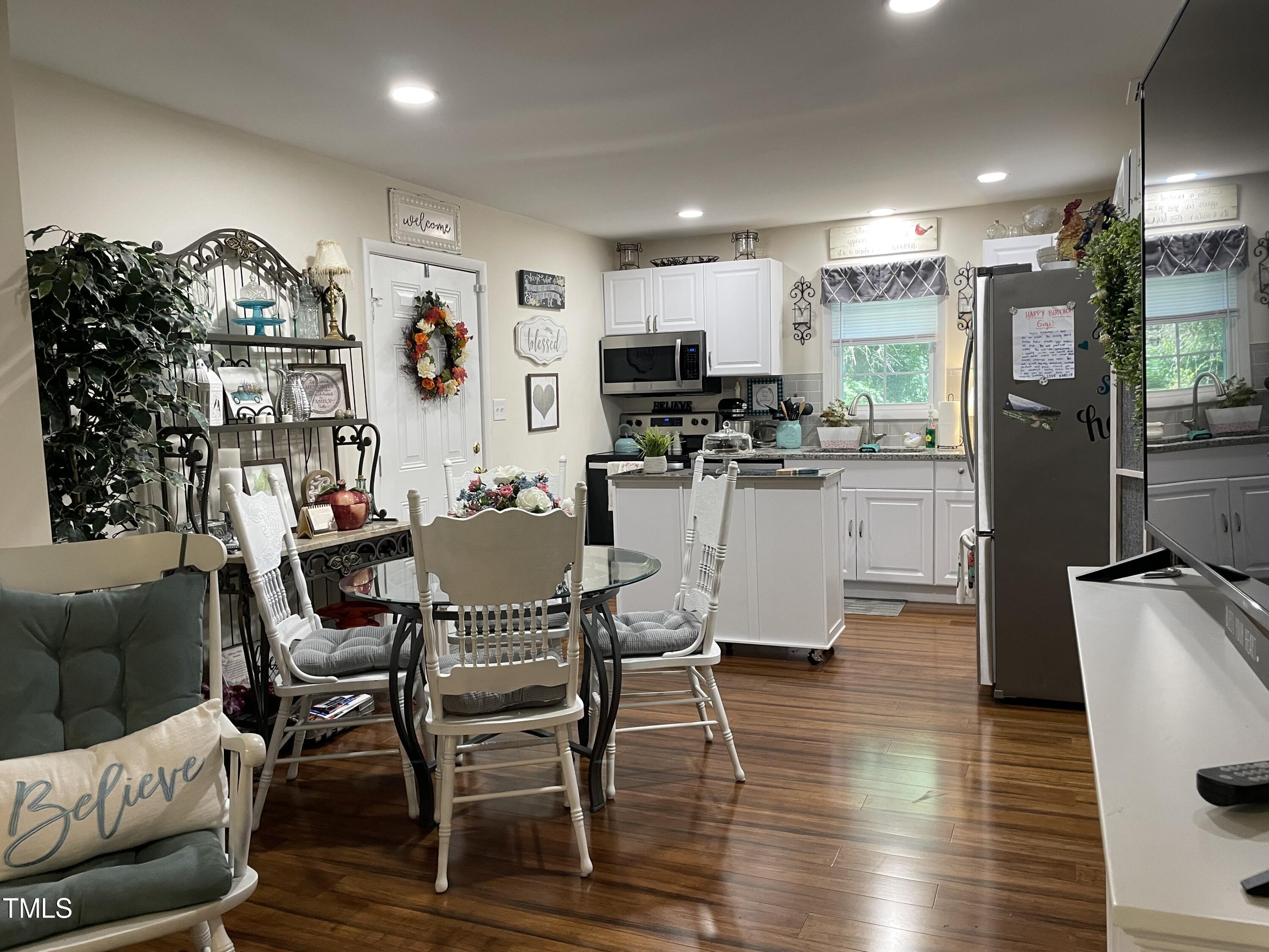 204 Jackson Street Dunn, NC 28334 - Photo 42 of 49 a view of a dining room with furniture and wooden floor