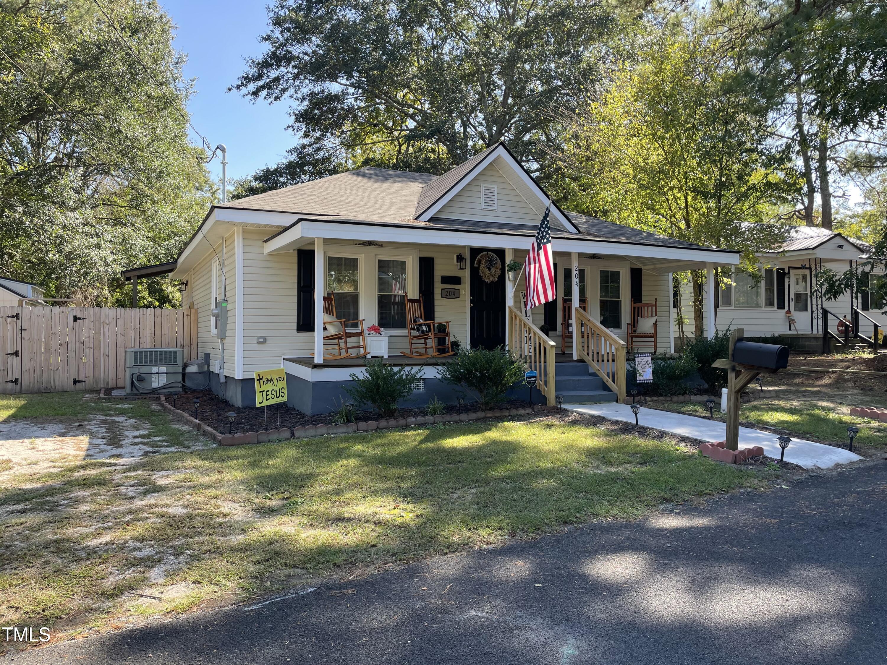 204 Jackson Street Dunn, NC 28334 - Photo 8 of 49 a view of a house with swimming pool and sitting area