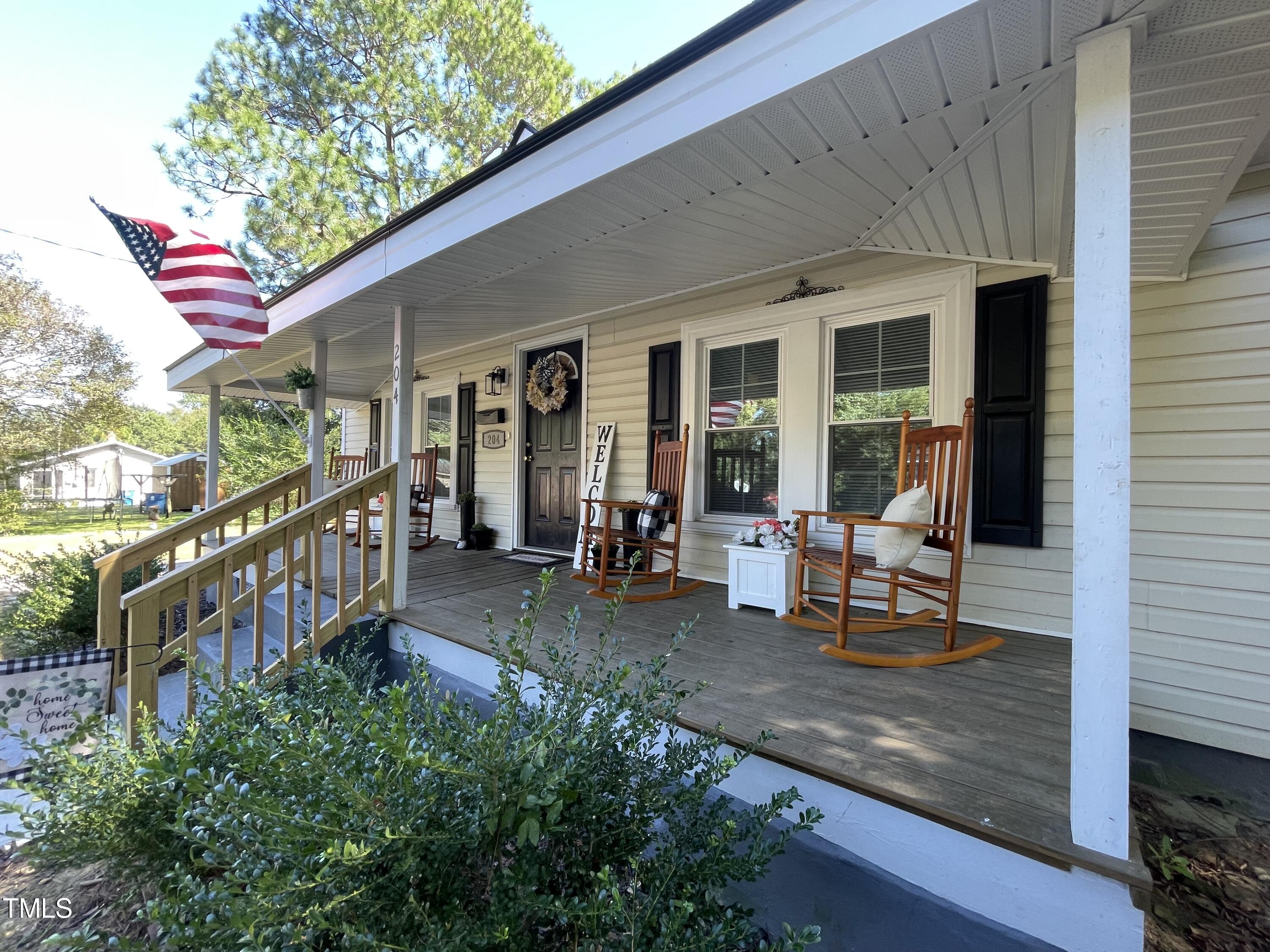 204 Jackson Street Dunn, NC 28334 - Photo 9 of 49 a view of a house with outdoor seating area