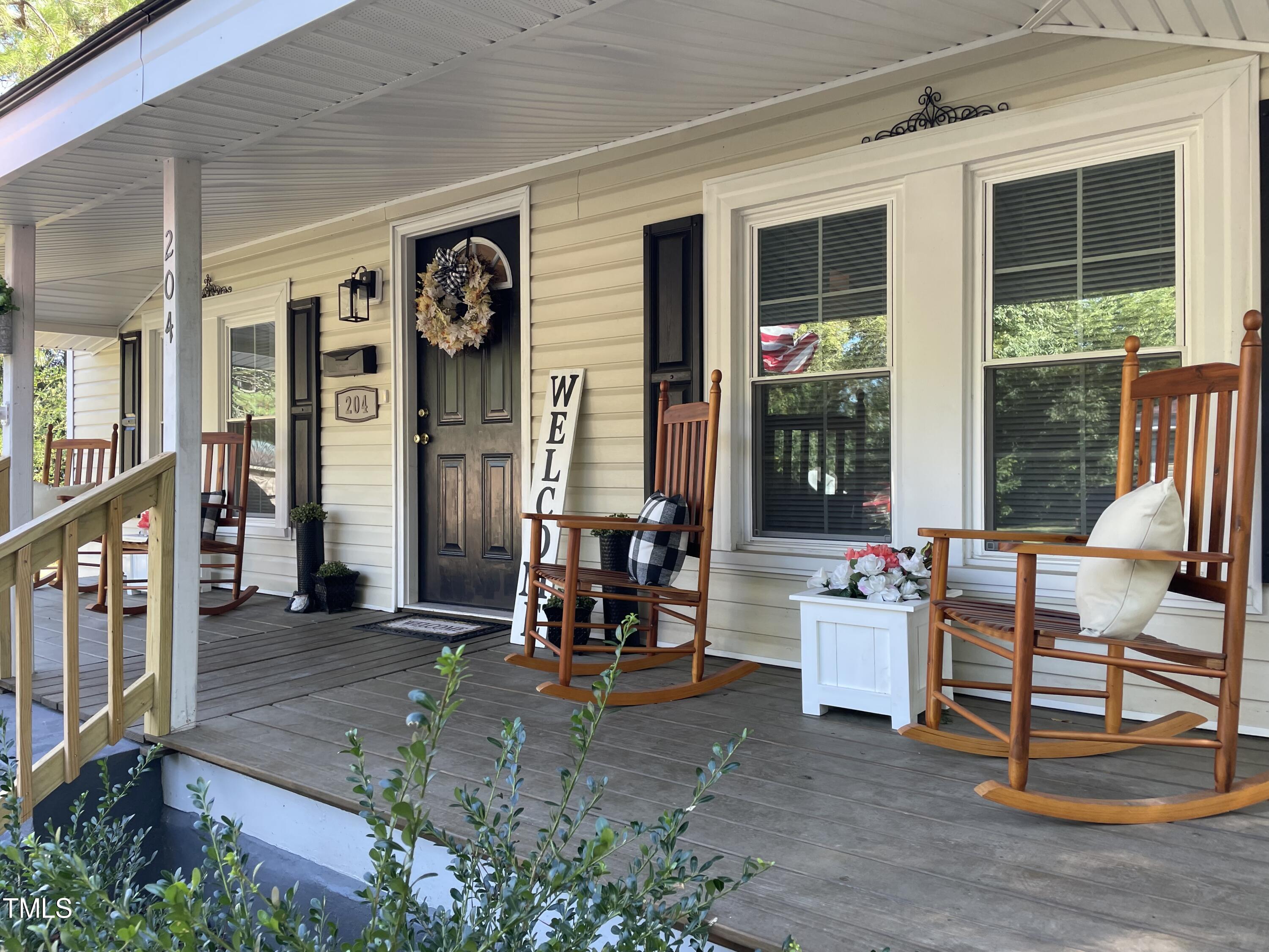 204 Jackson Street Dunn, NC 28334 - Photo 10 of 49 a building outdoor space with patio furniture