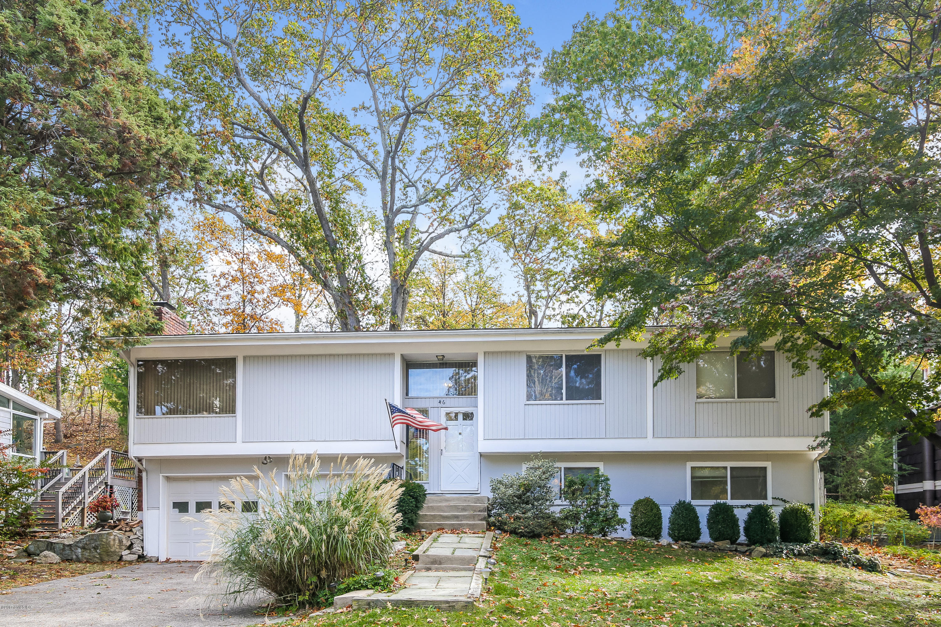 46 Crawford Terrace Riverside, CT 06878 - Photo 1 of 17 a front view of a house with garden