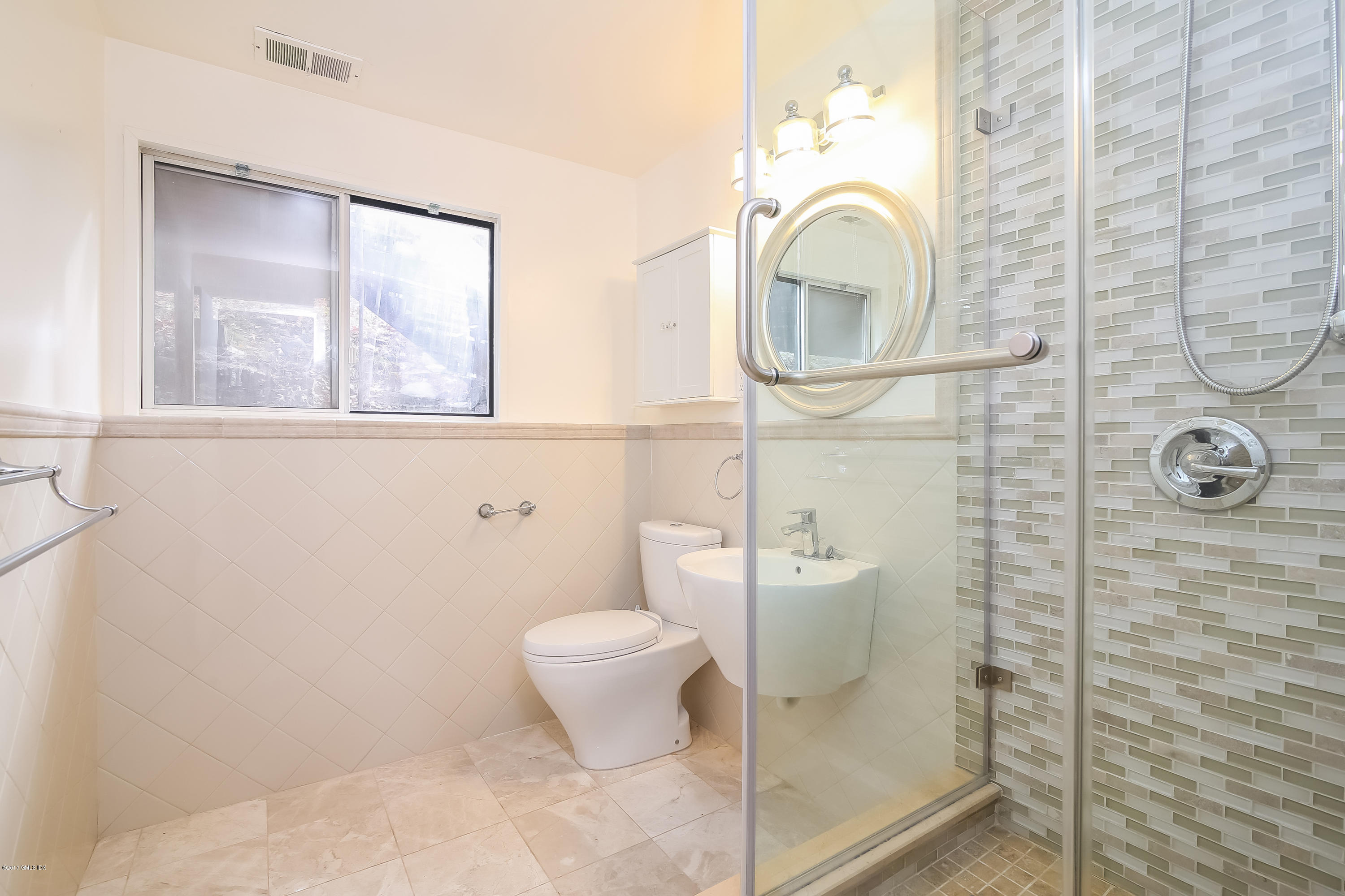 46 Crawford Terrace Riverside, CT 06878 - Photo 11 of 17 a bathroom with a toilet a sink and shower