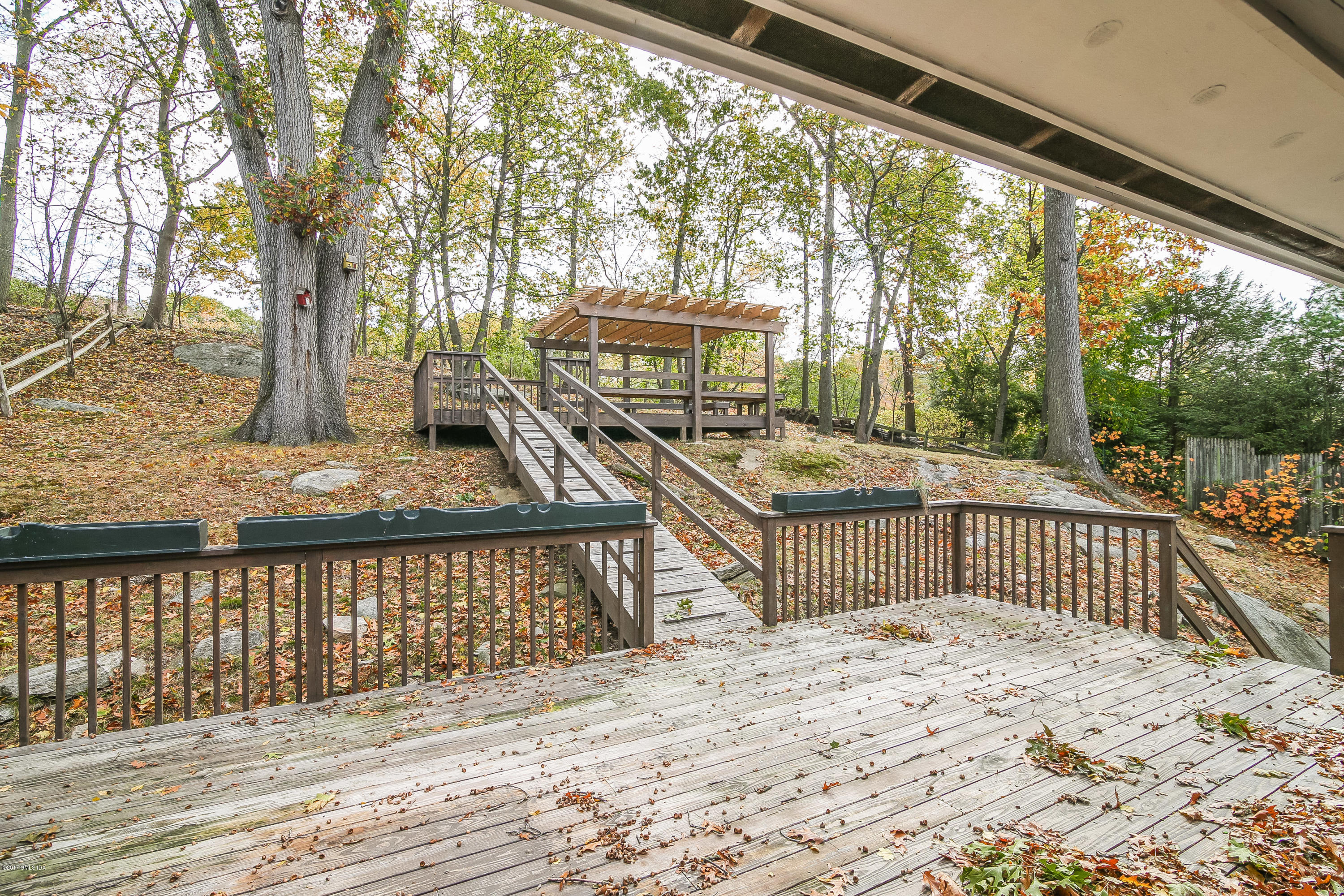 46 Crawford Terrace Riverside, CT 06878 - Photo 12 of 17 a view of a wooden deck with a yard