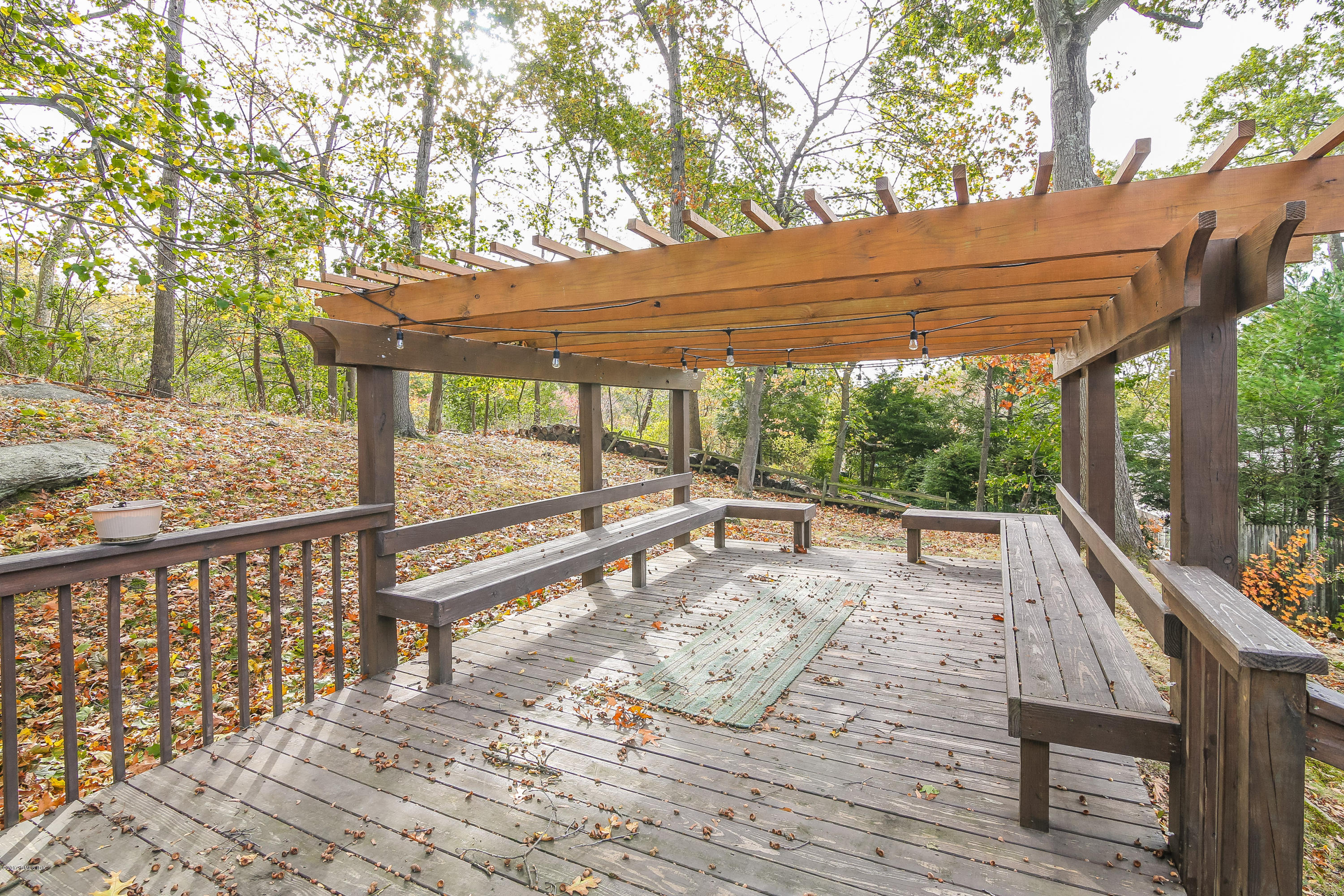 46 Crawford Terrace Riverside, CT 06878 - Photo 13 of 17 a view of a roof deck with wooden fence and floor