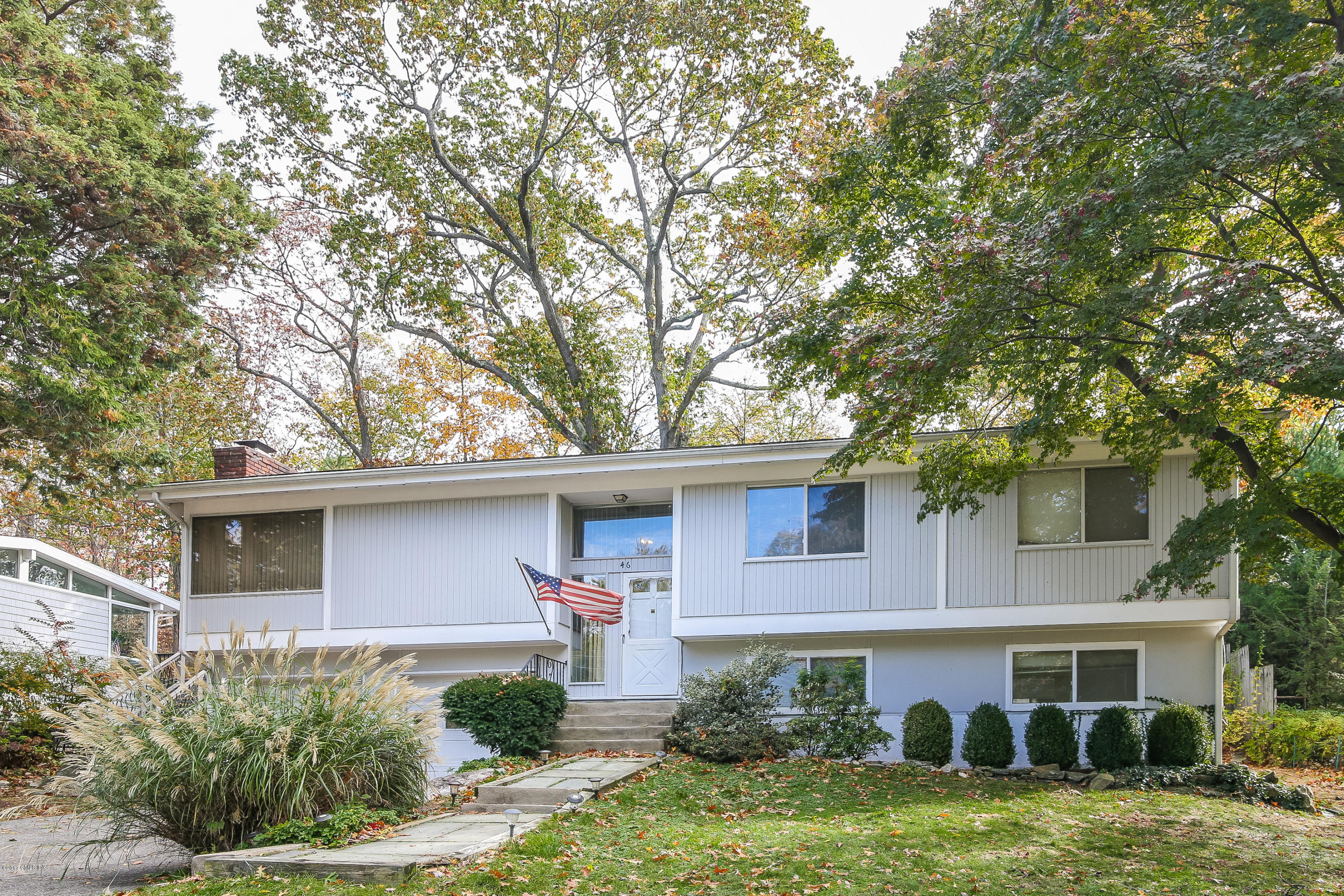 46 Crawford Terrace Riverside, CT 06878 - Photo 2 of 17 a front view of a house with a yard
