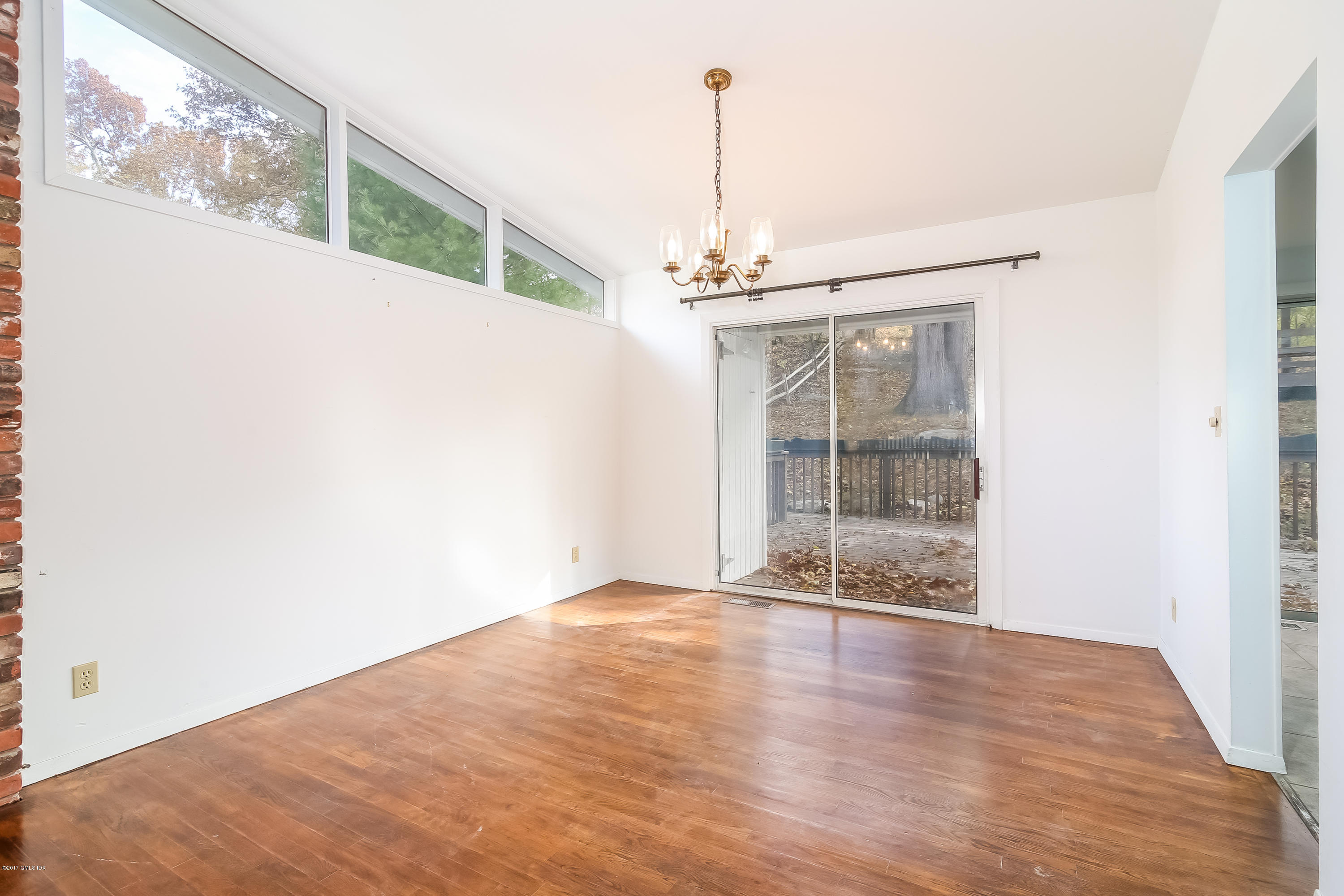 46 Crawford Terrace Riverside, CT 06878 - Photo 4 of 17 a view of a room with wooden floor large windows and entryway