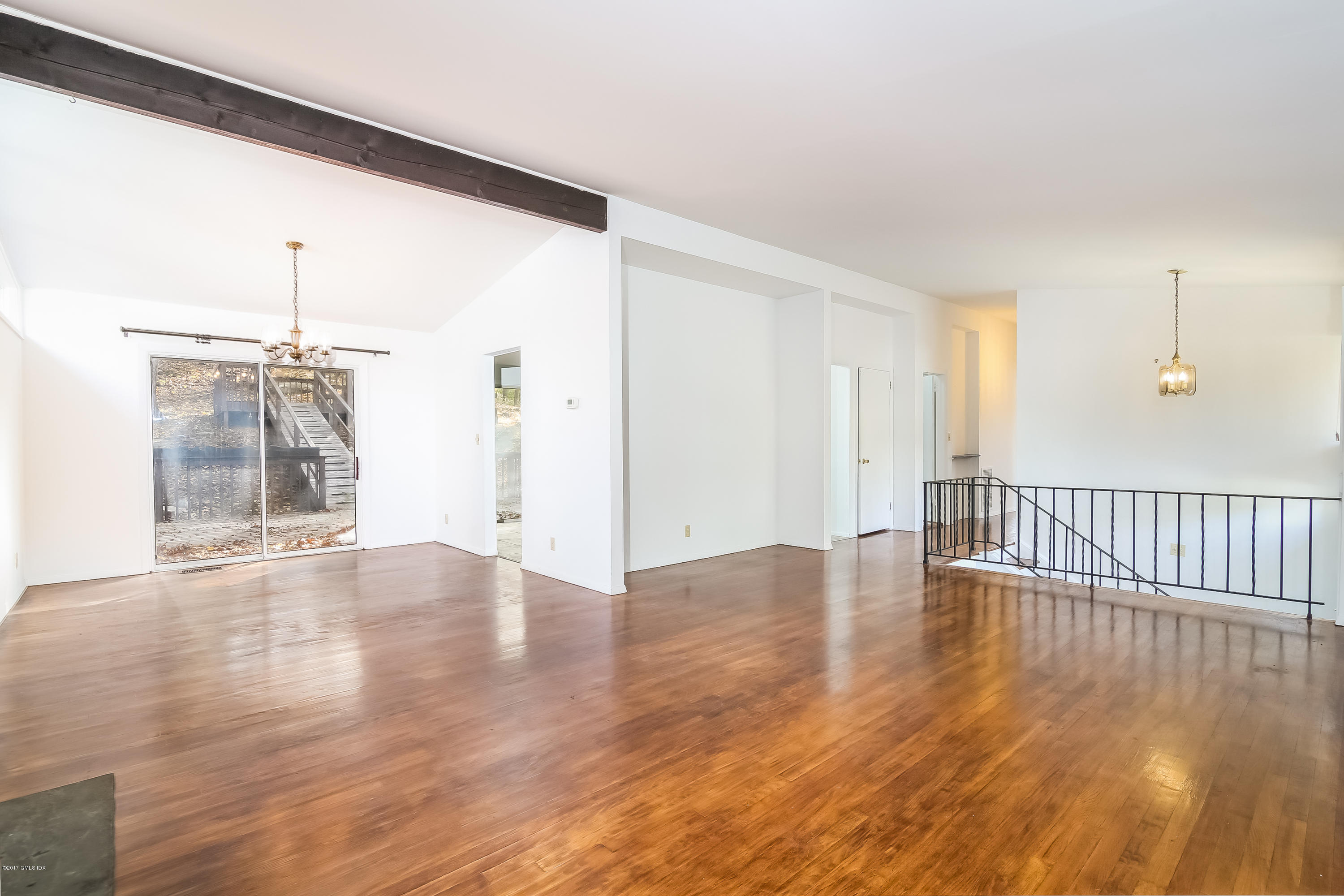 46 Crawford Terrace Riverside, CT 06878 - Photo 5 of 17 a view of an empty room with wooden floor and a window