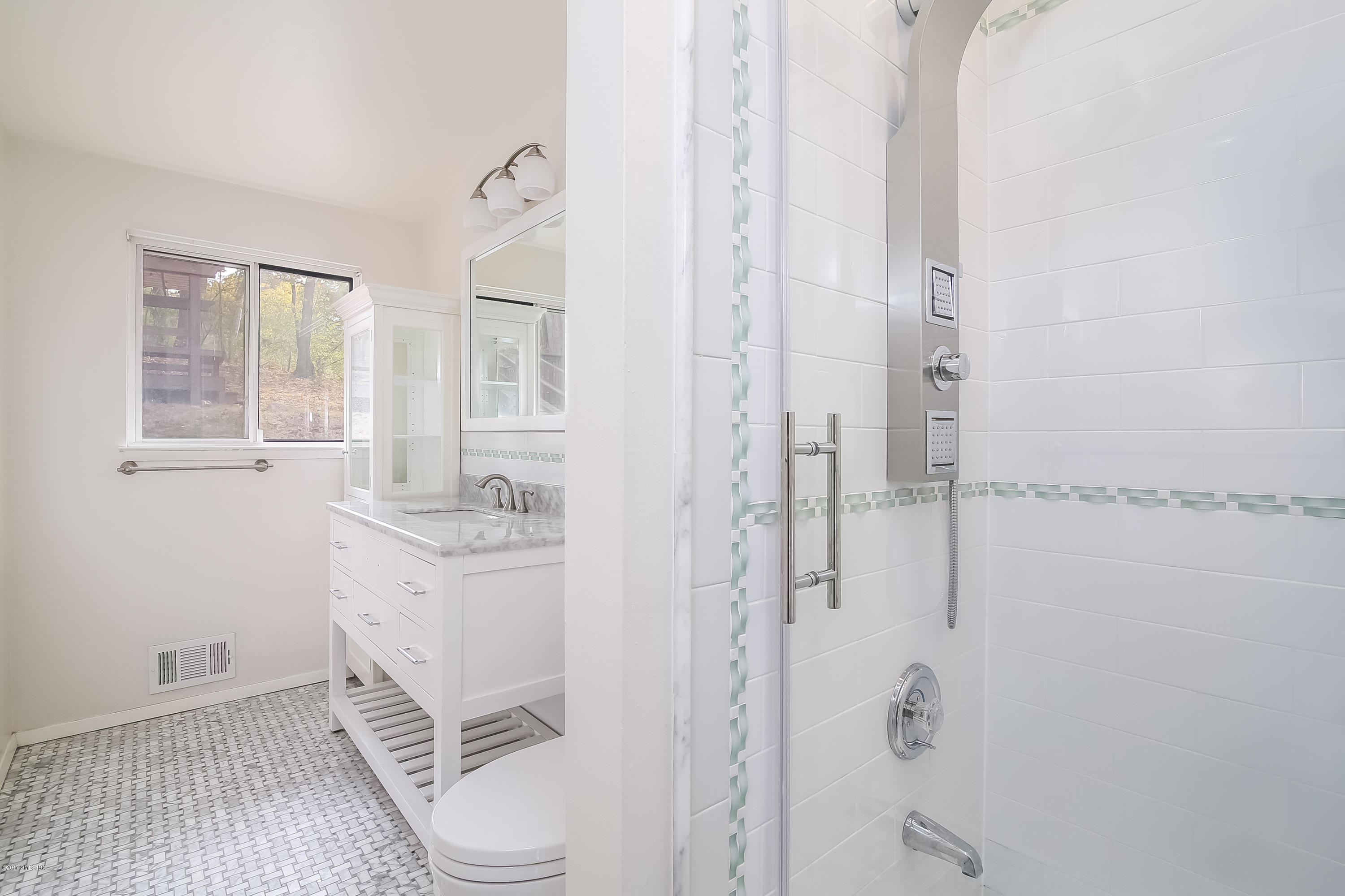 46 Crawford Terrace Riverside, CT 06878 - Photo 10 of 17 a bathroom with a granite countertop shower curtain and a sink