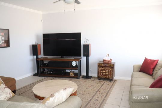 318 South Gordon Street Ridgecrest, CA 93555 - Photo 7 of 27 a living room with furniture and a flat screen tv