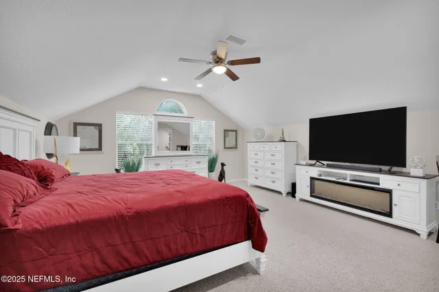 a bathroom with a granite countertop window and a shower