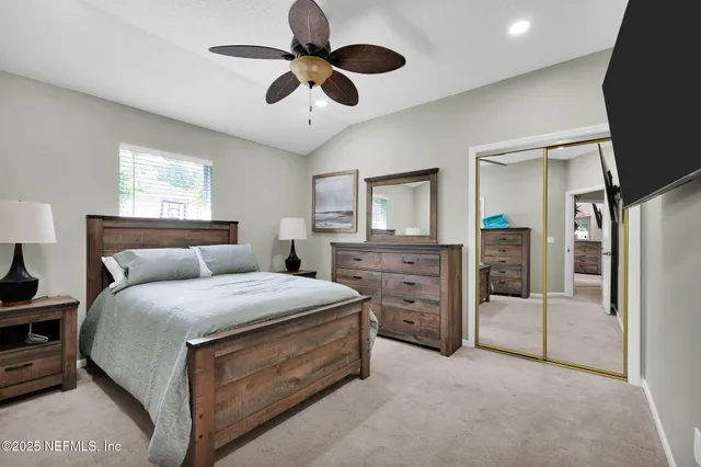 a view of a backyard with large trees