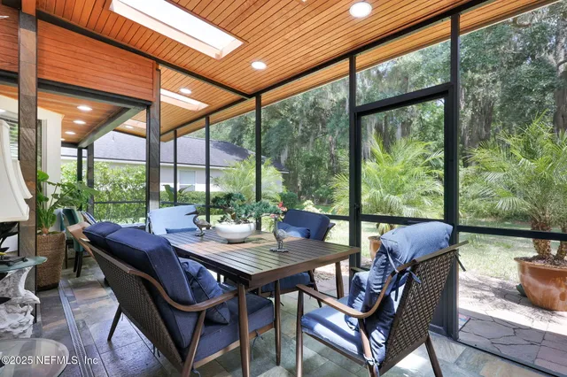 a view of a entryway with a livingroom