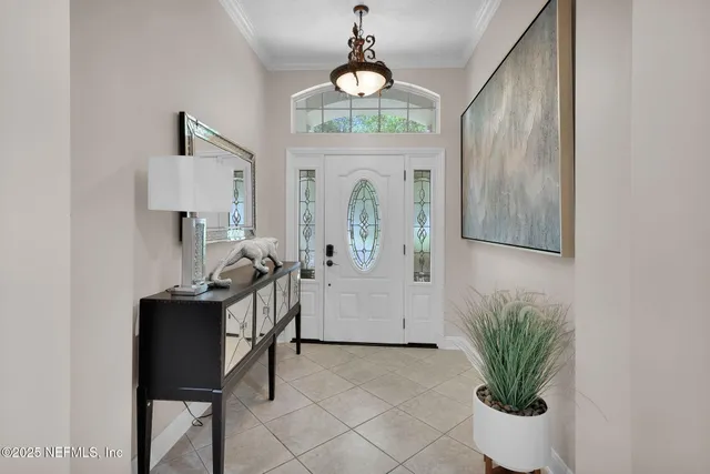 a view of living room with furniture and a chandelier